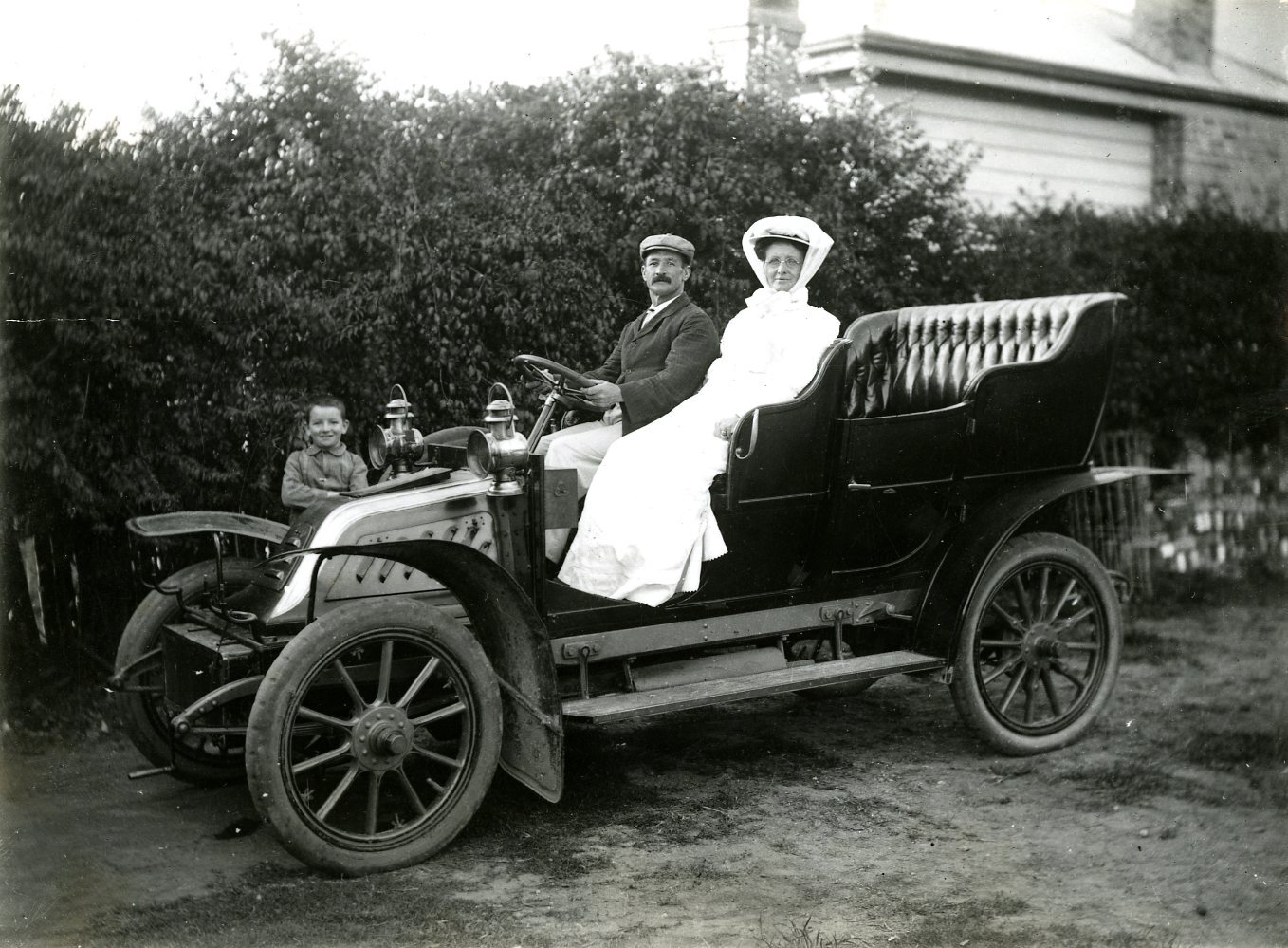 Couple Going For a Drive In Their New Car - c1910