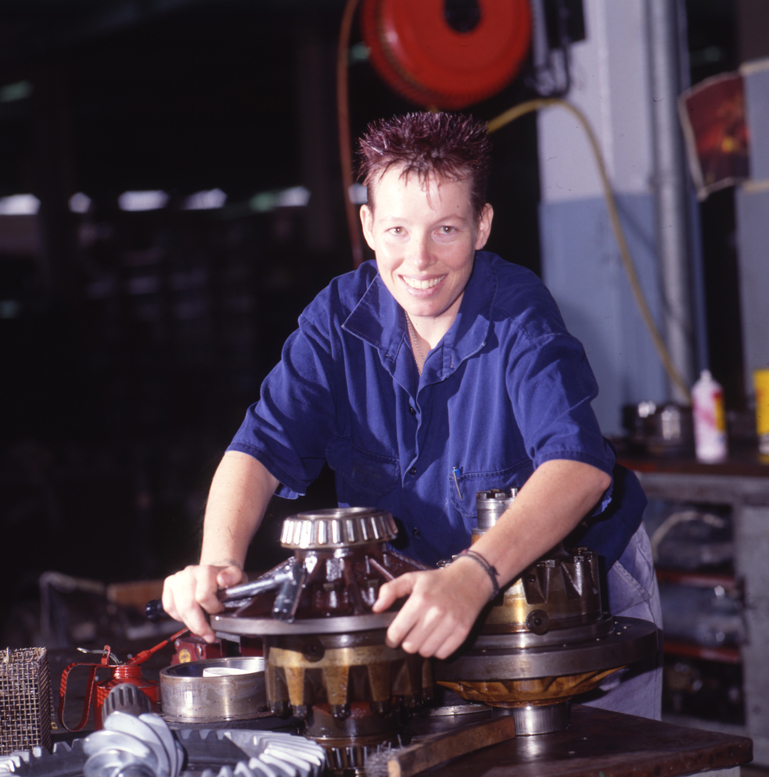 Female Mechanic Repairing Bus Wheel Bearing