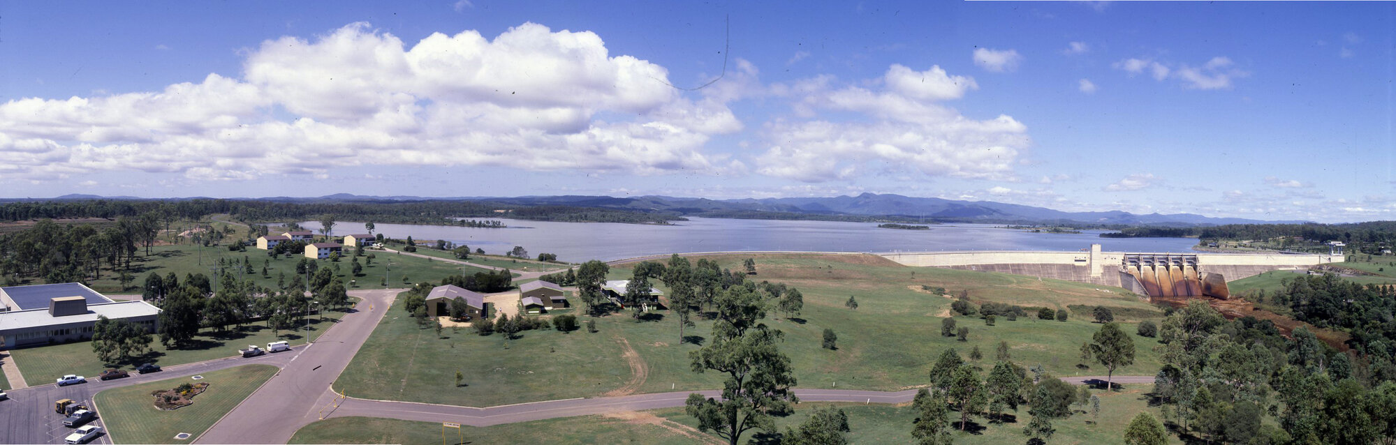 Panorama view of North Pine Dam - excess water being released from spillway due to being full for first time since completion