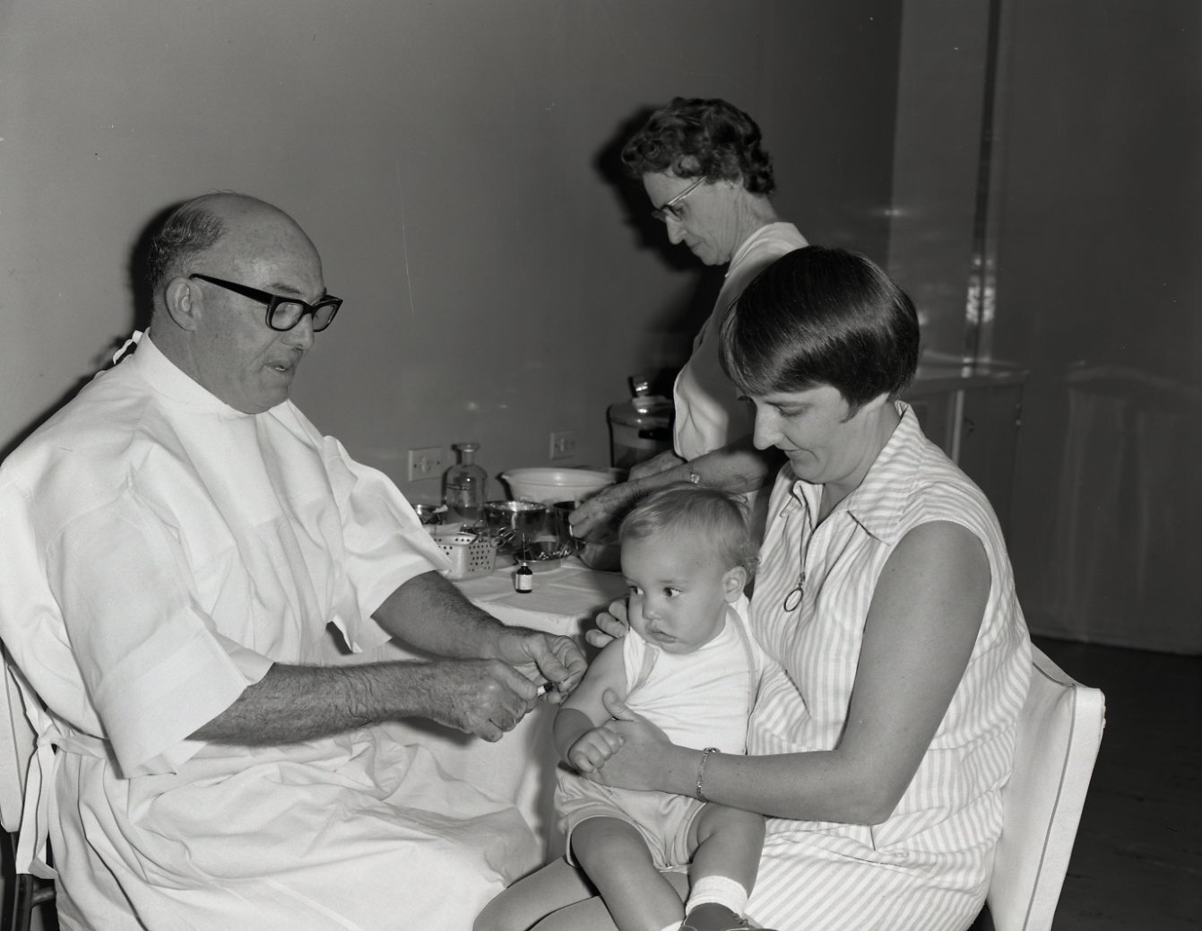 Infant Receiving an Injection - City Hall - 1971