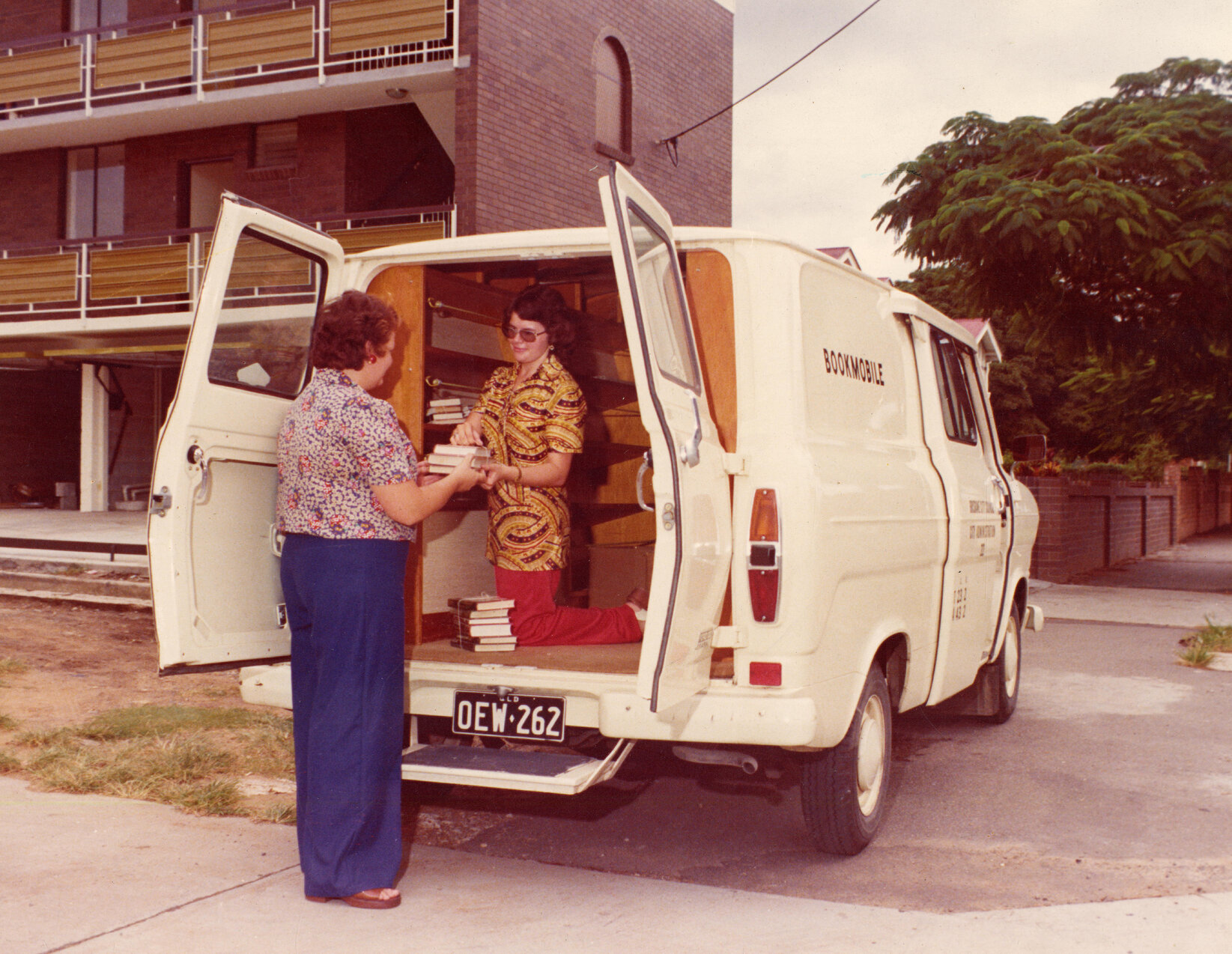 Library staff unloading the bookmobile - 1975
