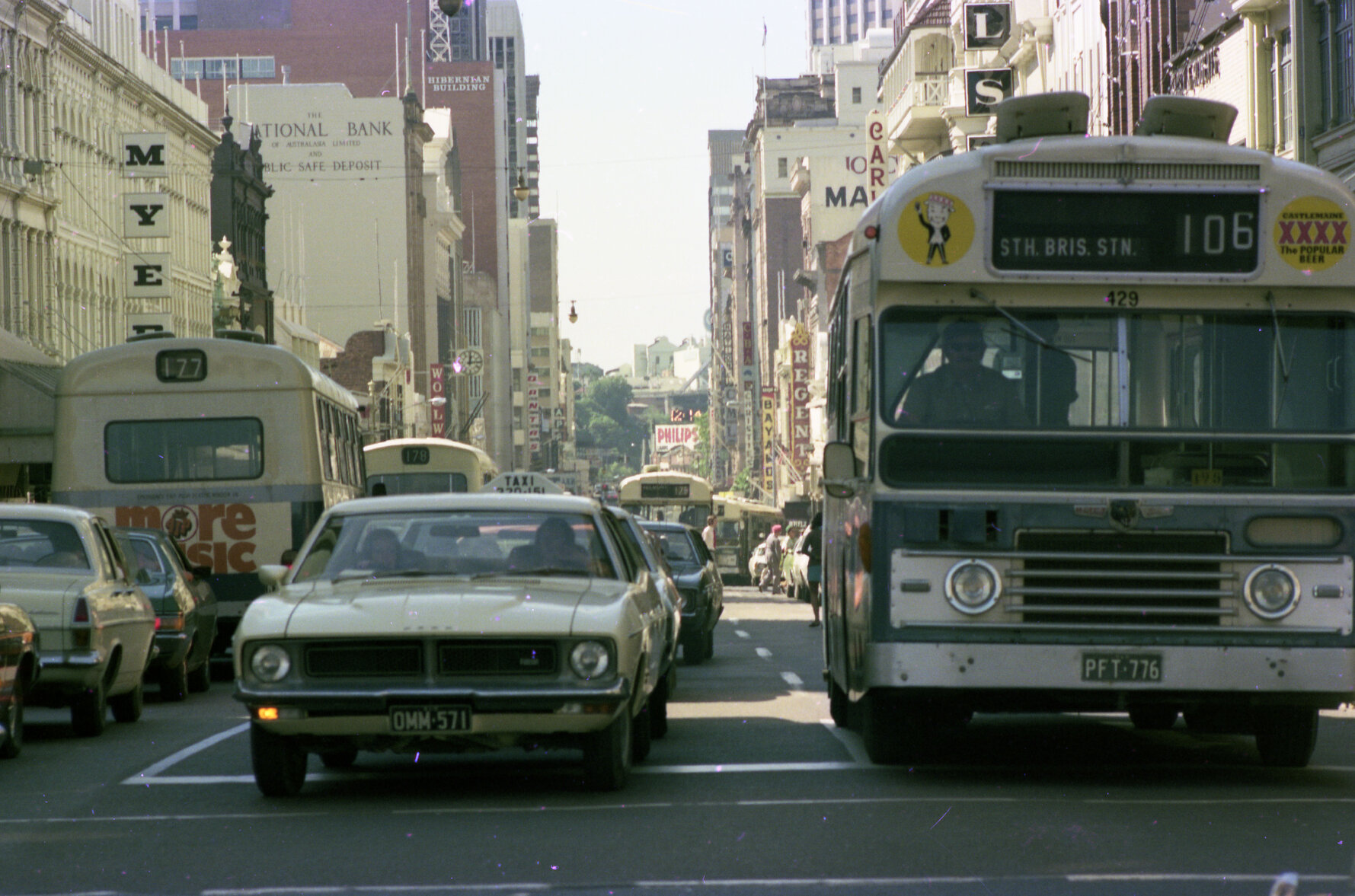 Bus in Queen Street traffic at corner of George Street, Brisbane City - 1975