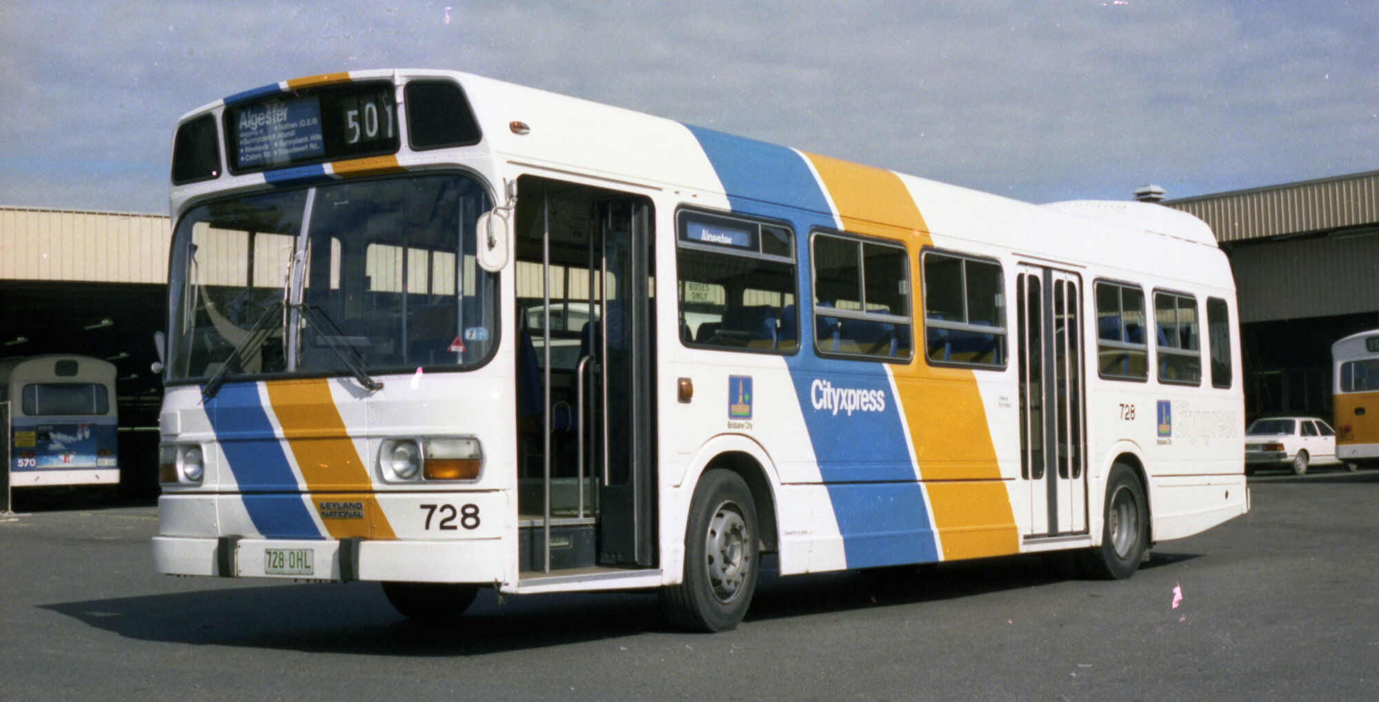 Leyland National bus and Leyland Panther bus in new Cityxpress colour scheme at Carina bus depot - 1983