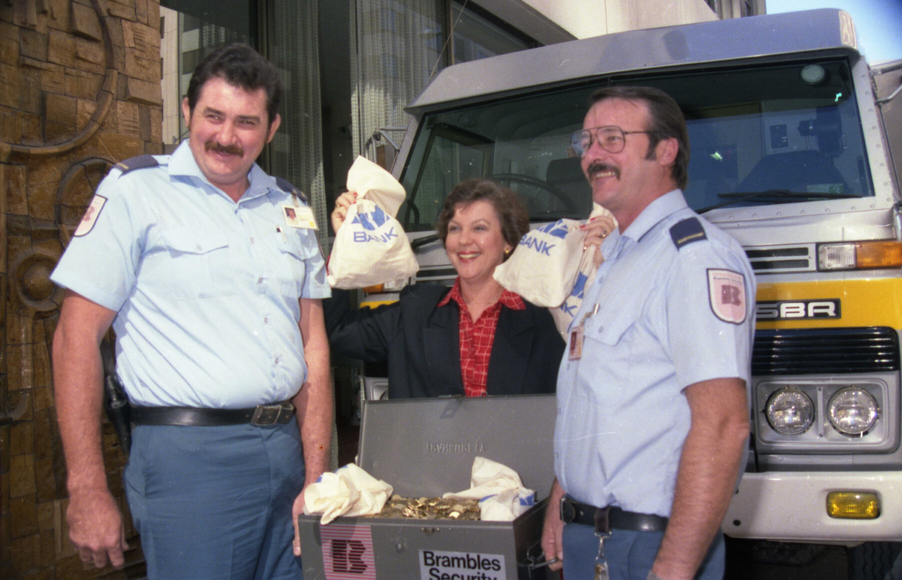 Lord Mayor Sallyanne Atkinson holding bags of money, a donation by ANZ and Brambles Security for the 1992 Olympic bid - 1986