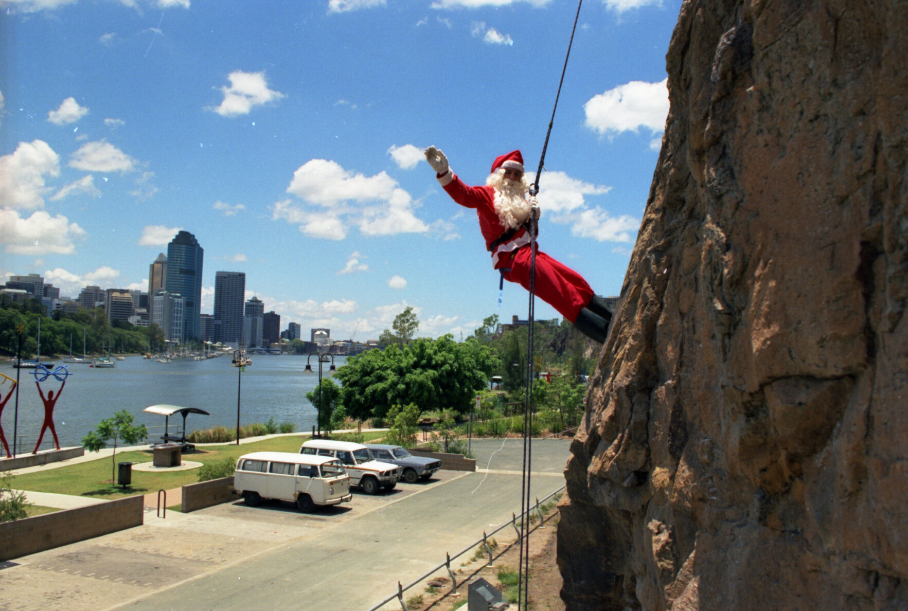 Santa Claus abseiling down newly pinned section of Kangaroo Point Cliffs - 1994