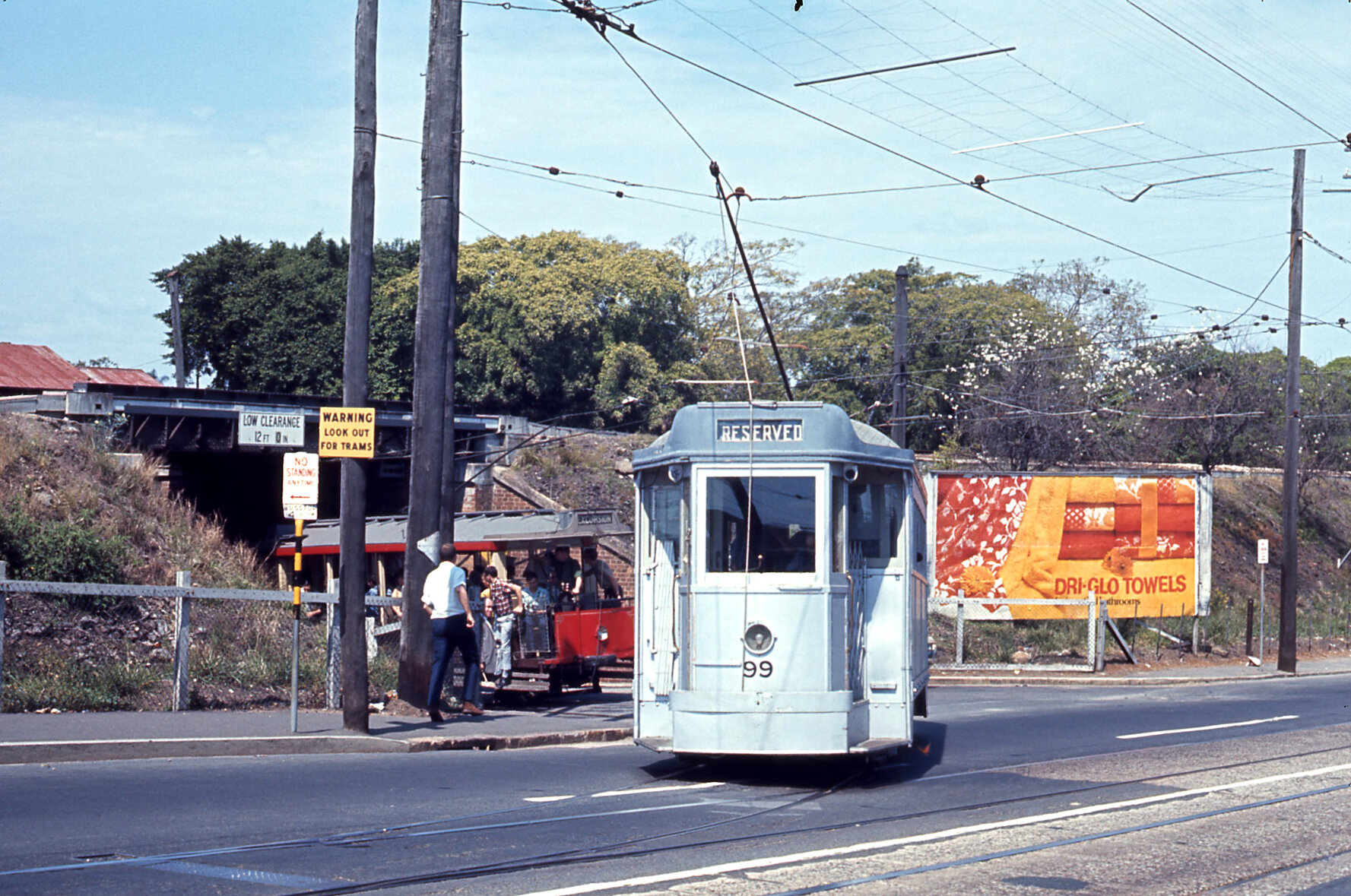 Trams No. 99 and No. 65 on Milton Road turning into side road - 1968