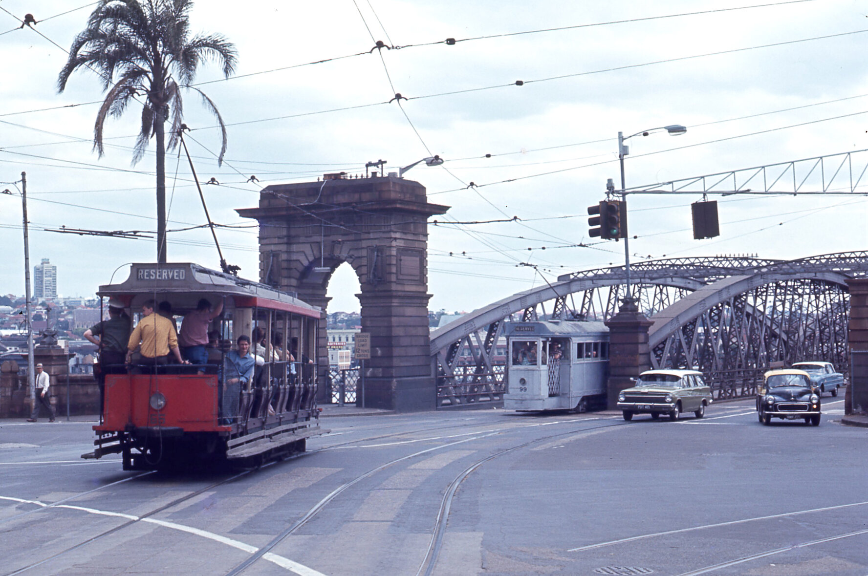Trams No. 66 and 99 approaching Victoria Bridge from Queen Street, Brisbane City - 1968