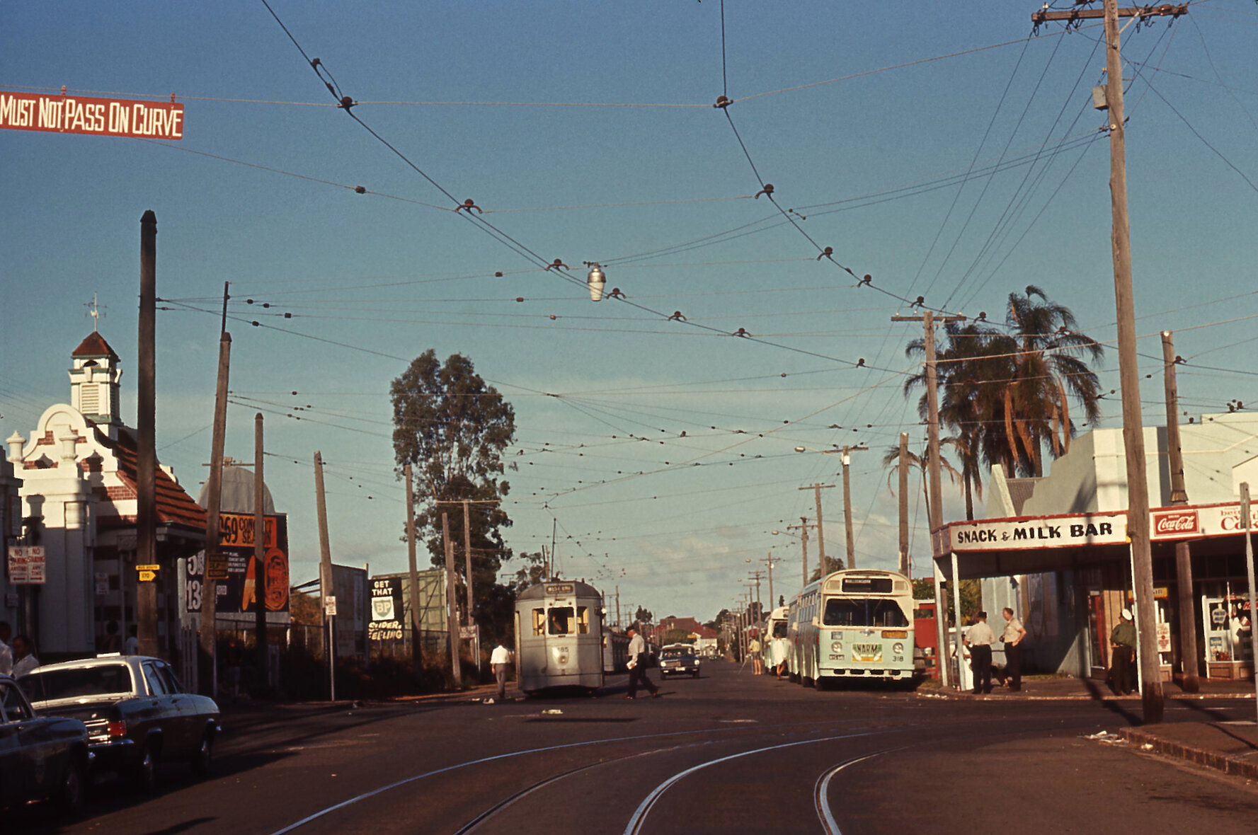 Tram No. 485 and Leyland bus No. 318 on corner of Lancaster Road and Racecourse Road outside entrance to Eagle Farm Racecourse, Ascot - 1969