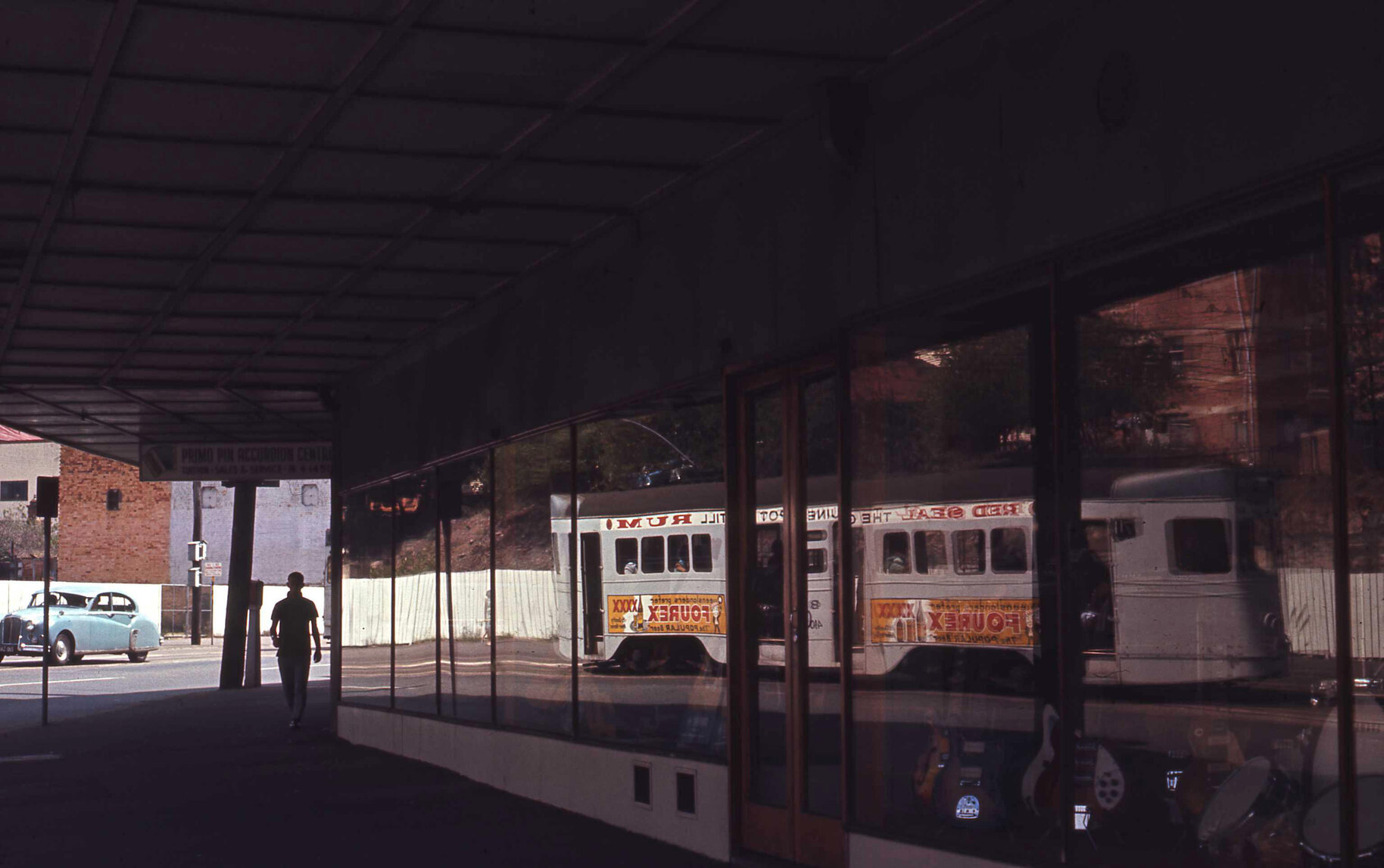 Reflection of tram No. 410 in music shop window - Stanley Street, Woolloongabba - 1969