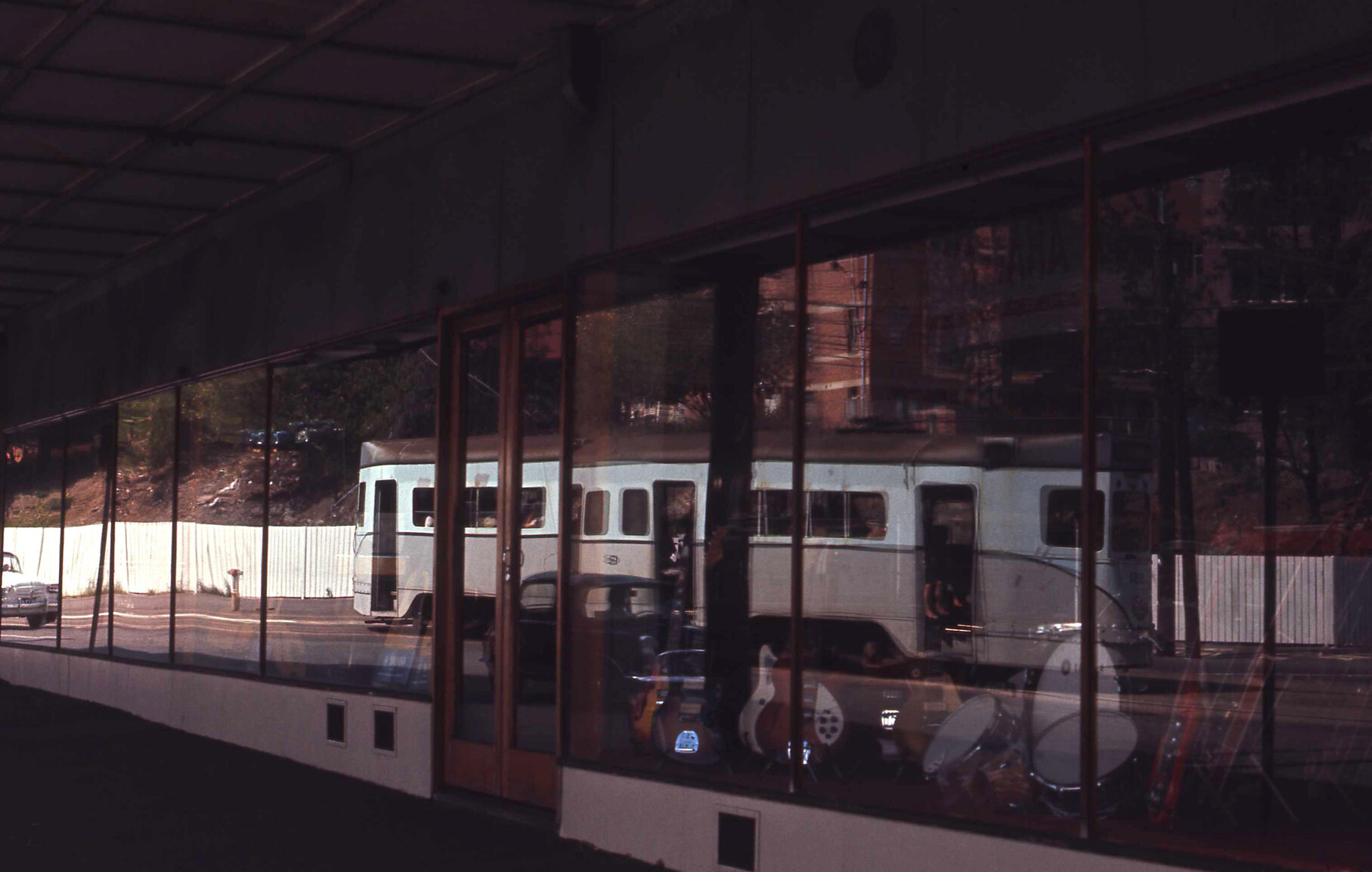 Reflection of tram No. 551 in music shop window - Stanley Street, Woolloongabba - 1969