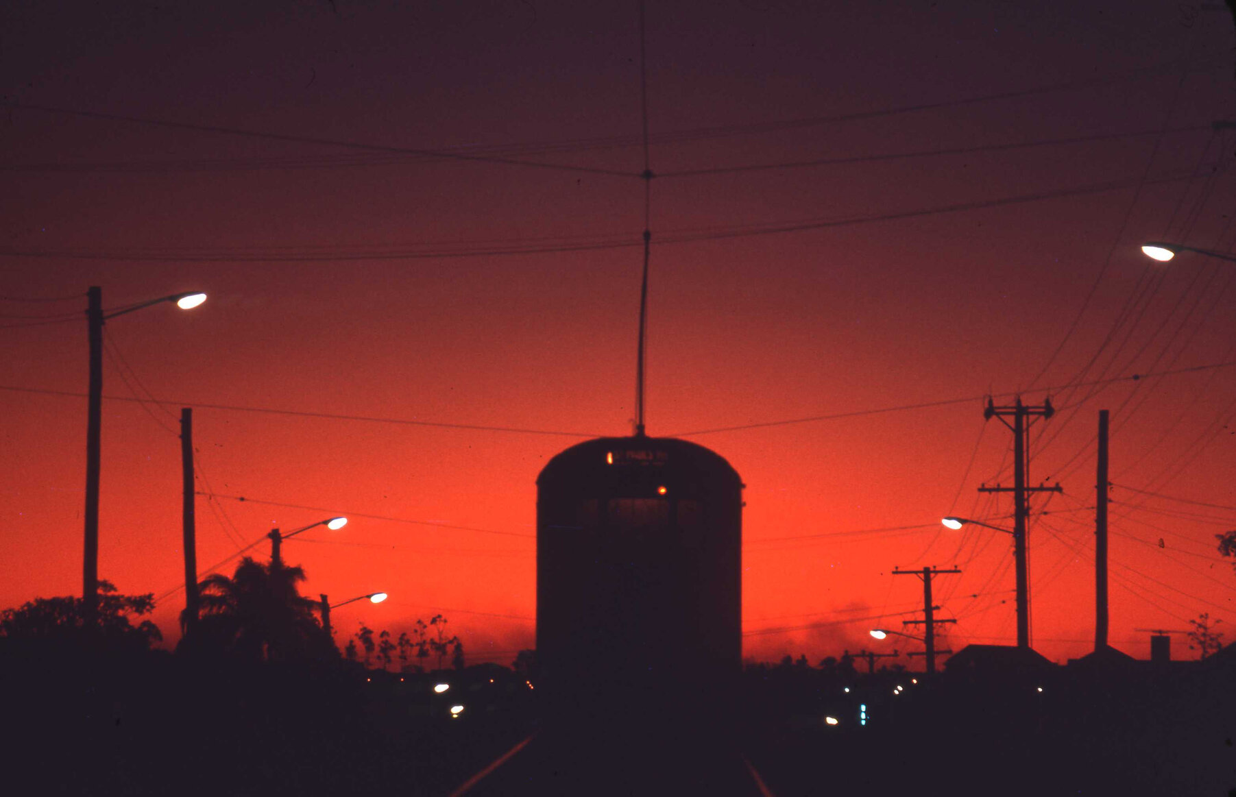 Tram during a red sunset, O'Keefe Street, Woolloongabba -1969