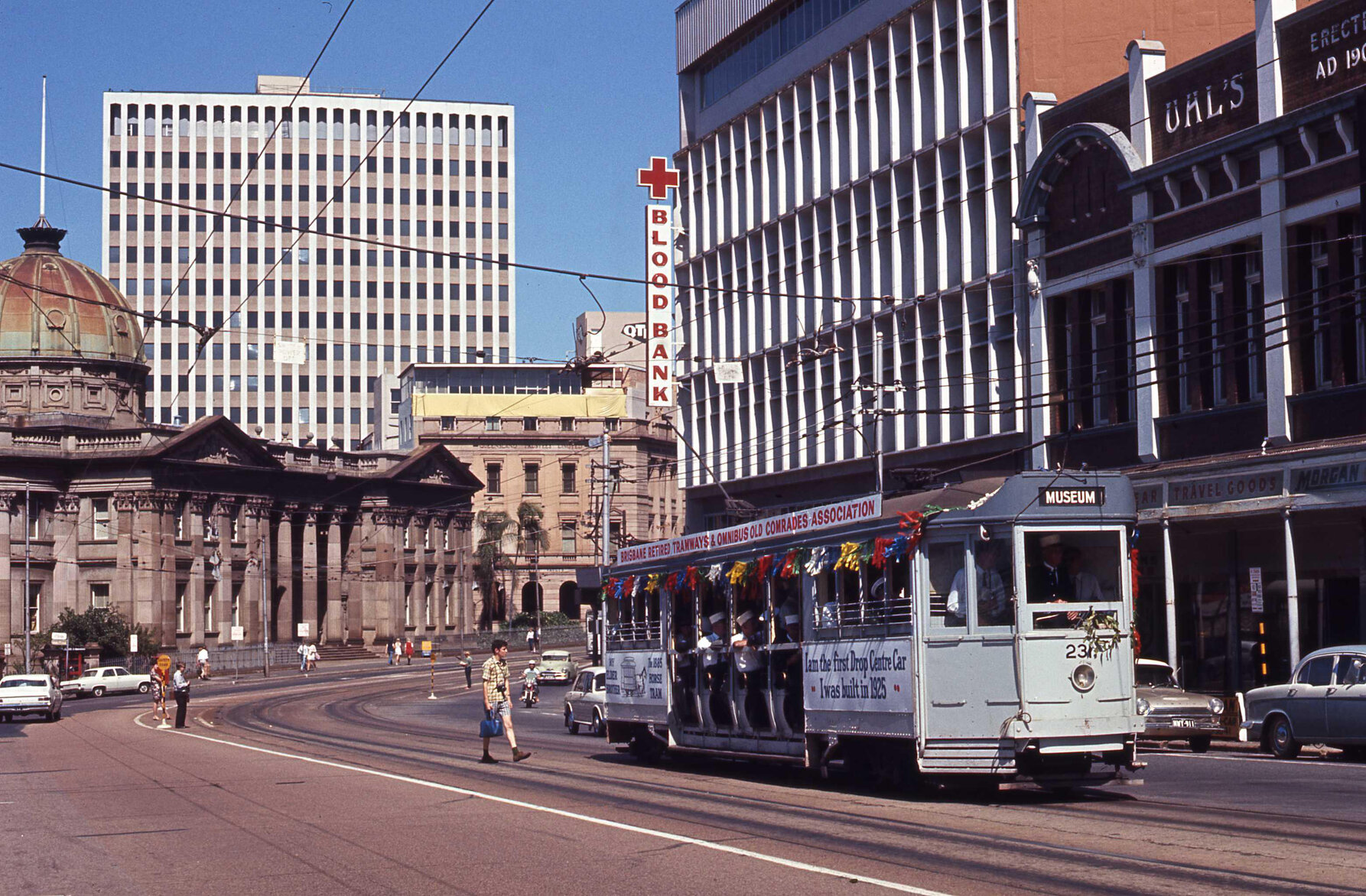 Tram No. 231 festooned in ribbons, filled with tram drivers outside Customs House, Queen Street, 1969