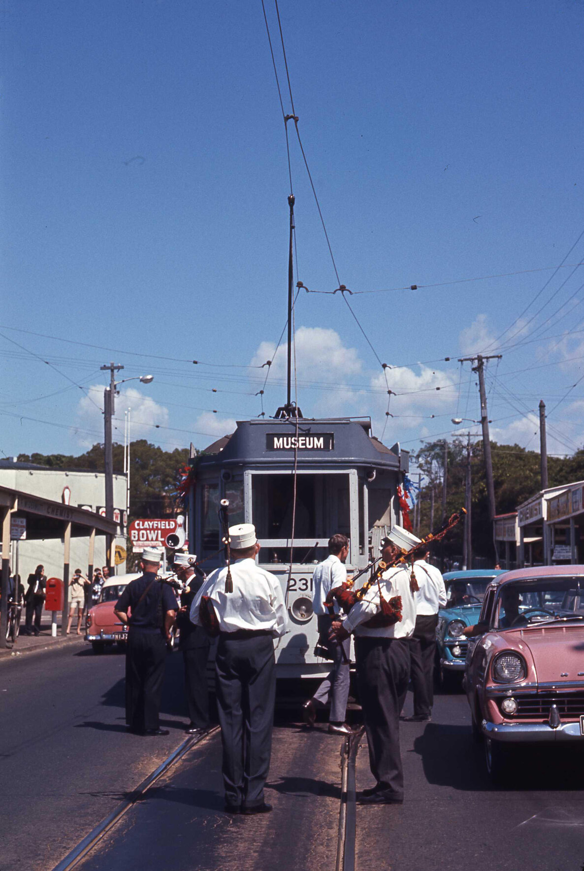 Tram No. 231 on Sandgate Road, Clayfield accompanied by bagpipers - 1969