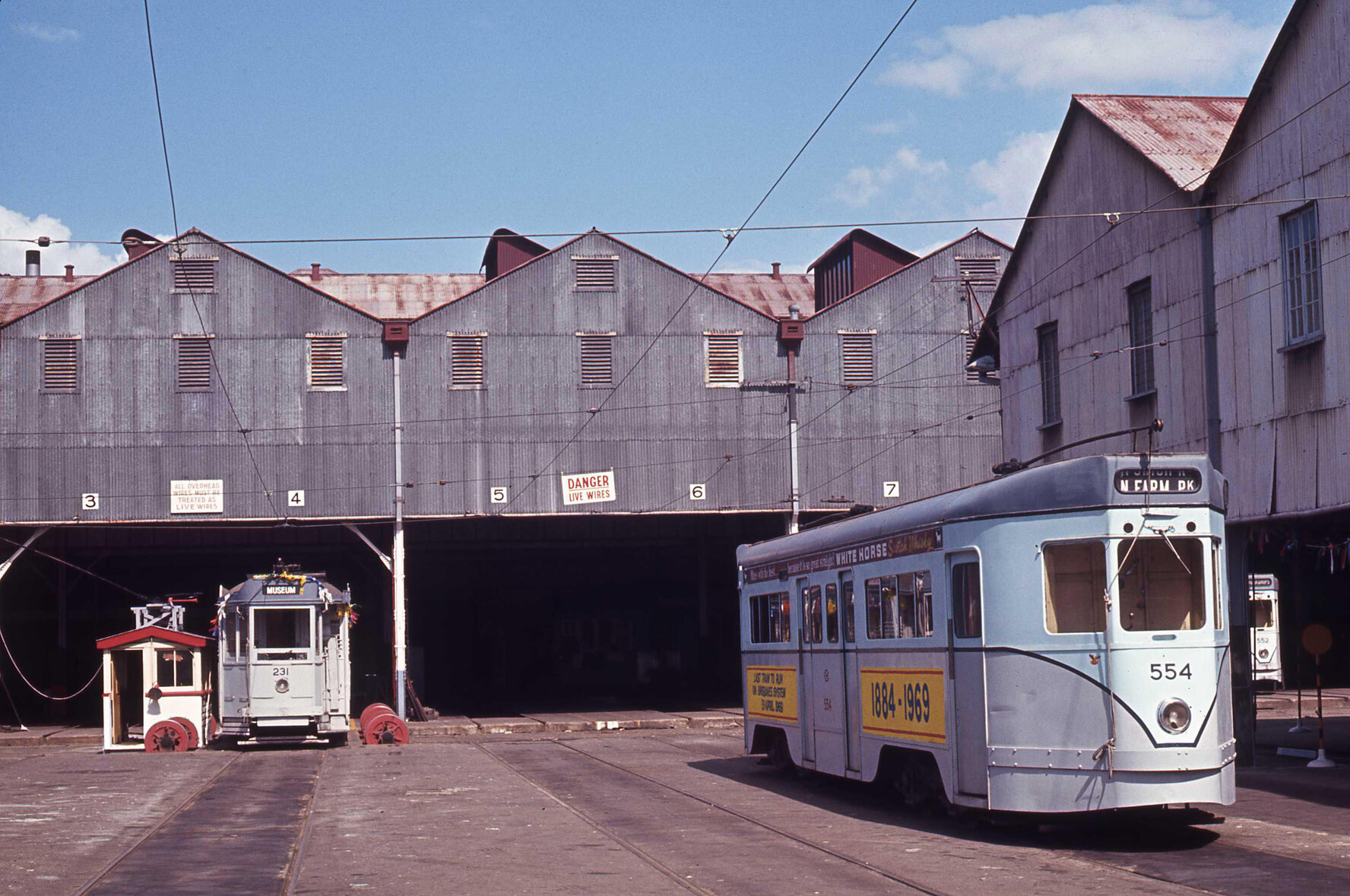 Tram No. 554 with livery proclaiming it the last tram to run on Brisbane's tram system, No. 231 in background, Milton depot - 1969