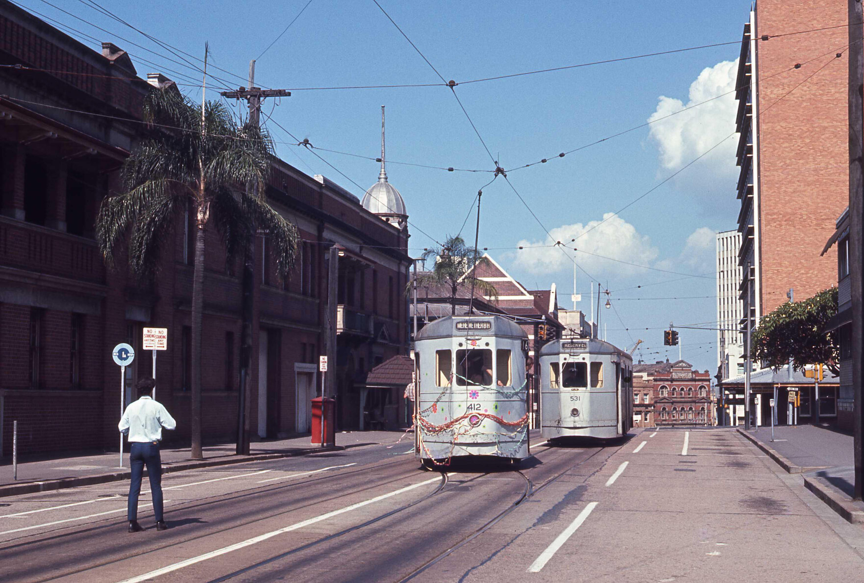 Tram No. 412 painted with flowers and covered with ribbons with No. 531 on Wharf Street - 1969