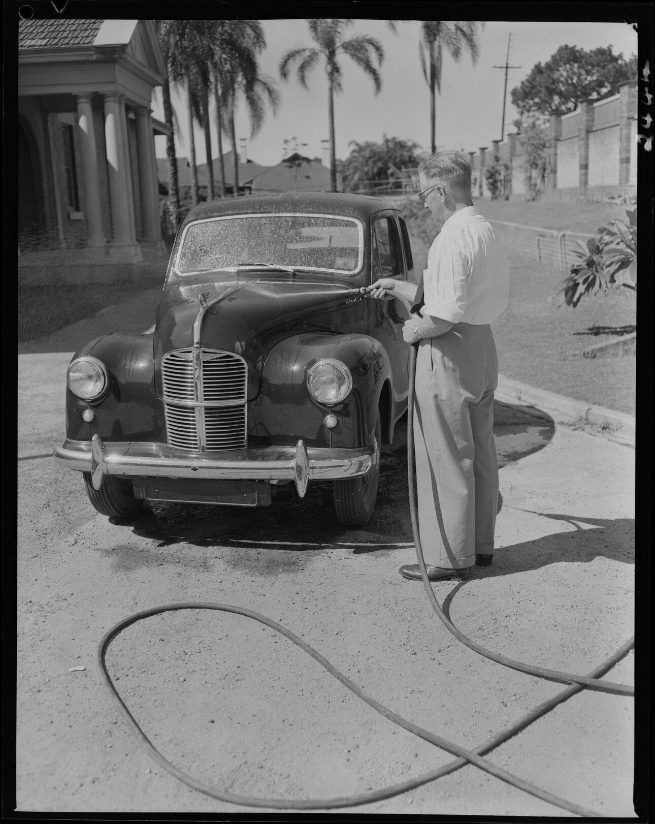 Man washing car - 1952