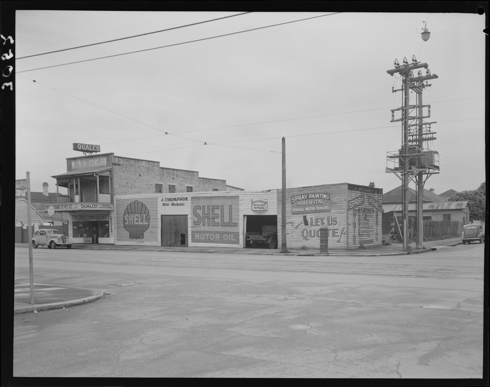 Shell motor mechanic and Qualco furniture on the corner of Melbourne Street, West End - 1952