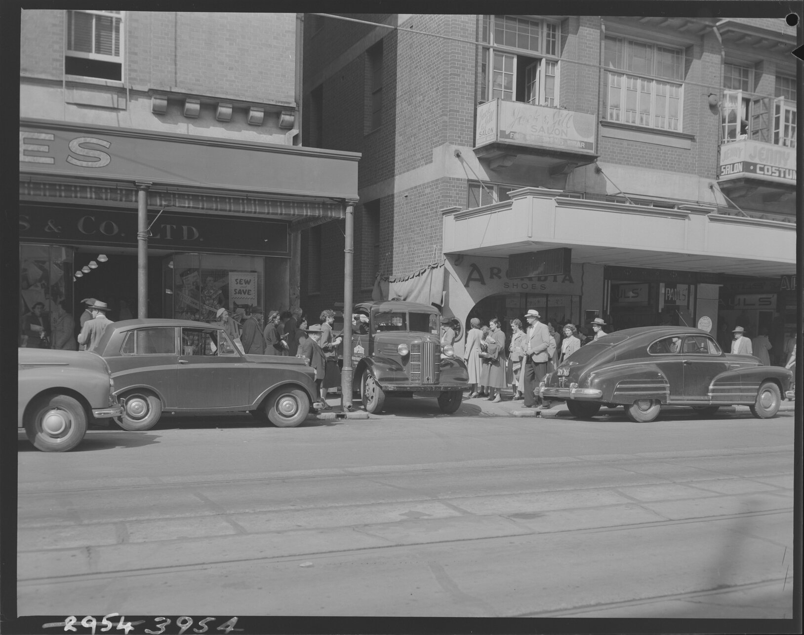 People near laneway on Adelaide Street near Arcadia Shoes - 1953