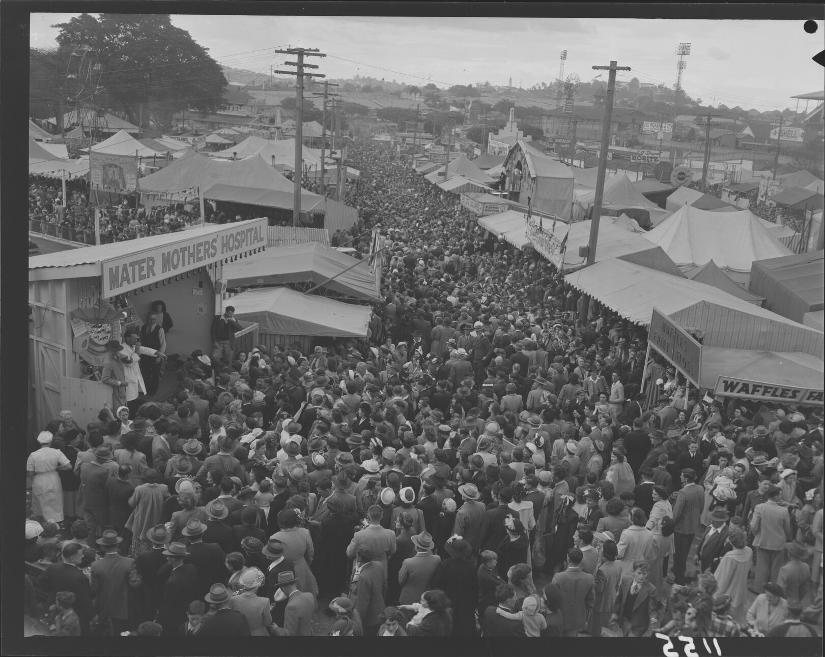 Crowds at stalls in Exhibition (Ekka) grounds - 1950