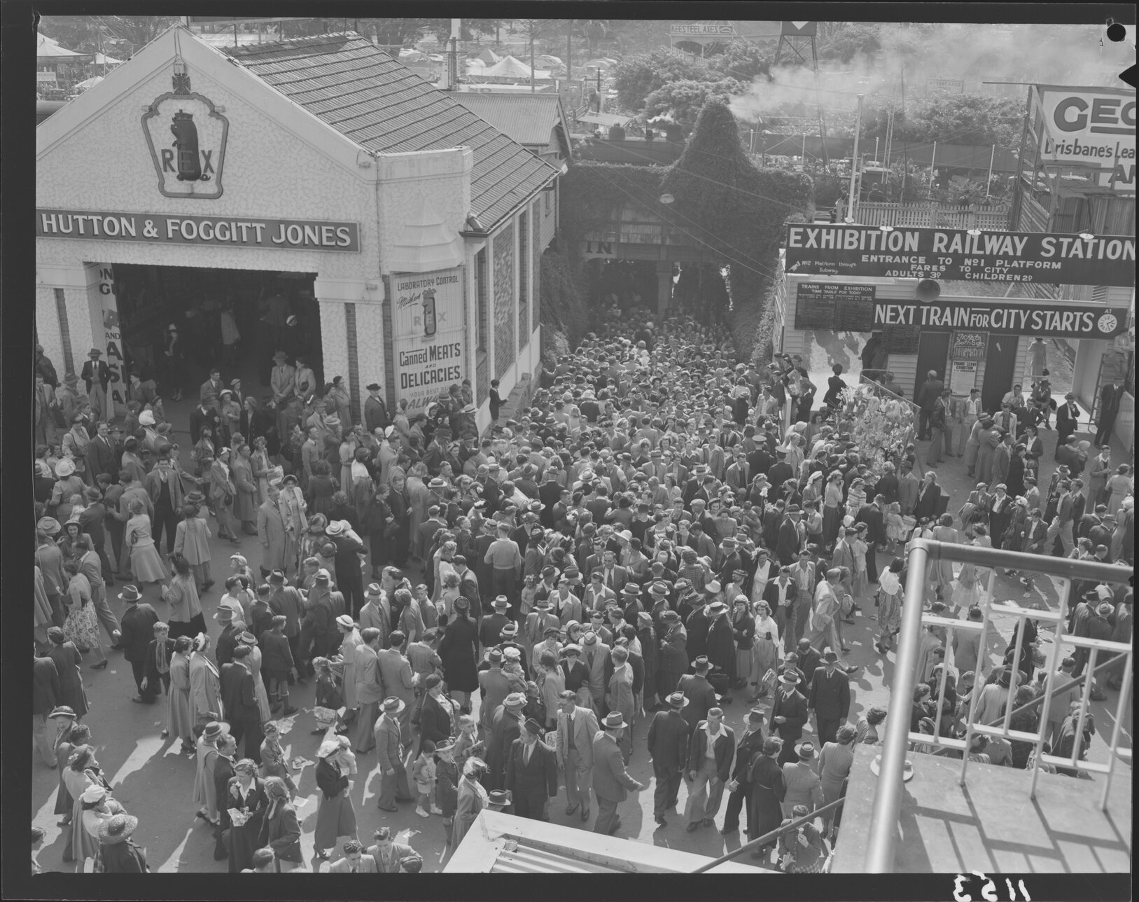 Crowds at railway station at Exhibition (Ekka) grounds - 1950