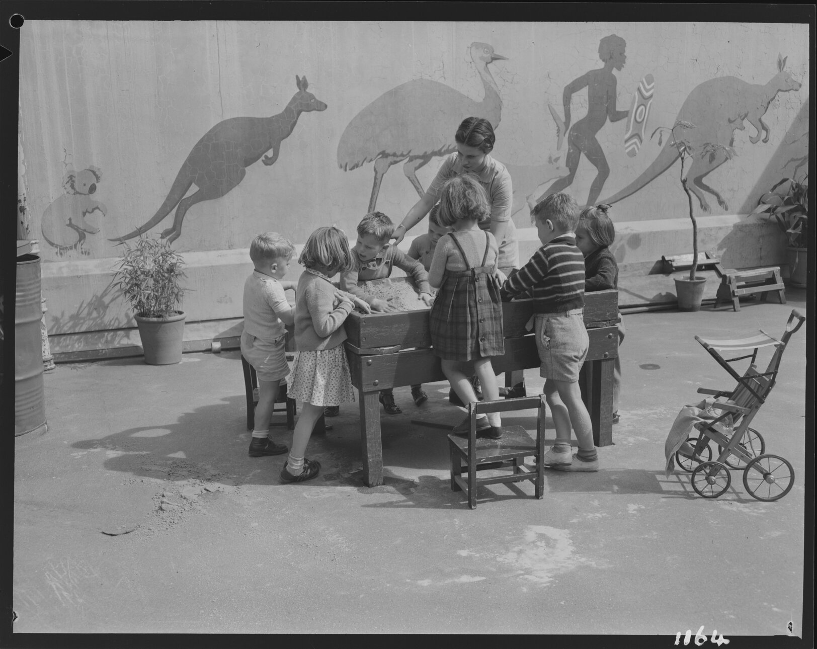 Children playing with sandbox at Kindercraft Civic Nursery (childcare) City Hall - 1950
