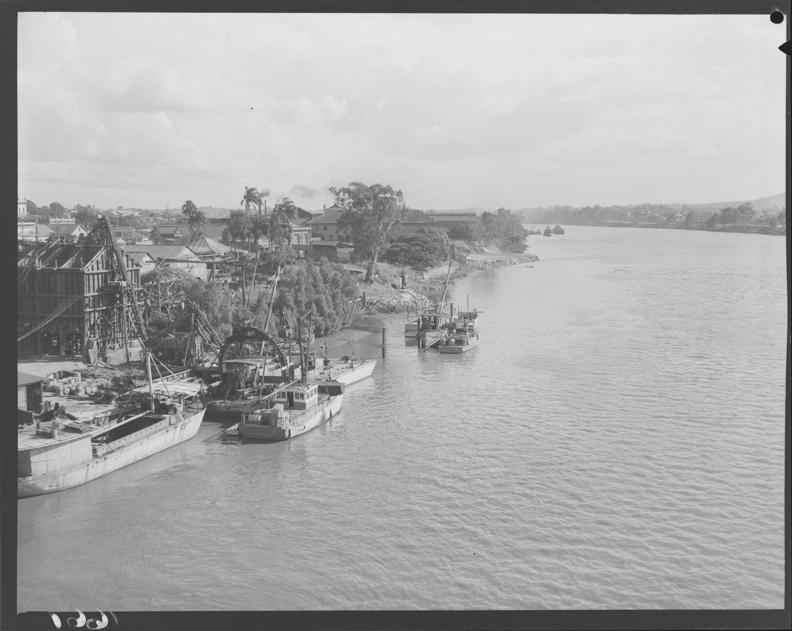 View of south river bank with barges and construction, South Brisbane - 1951