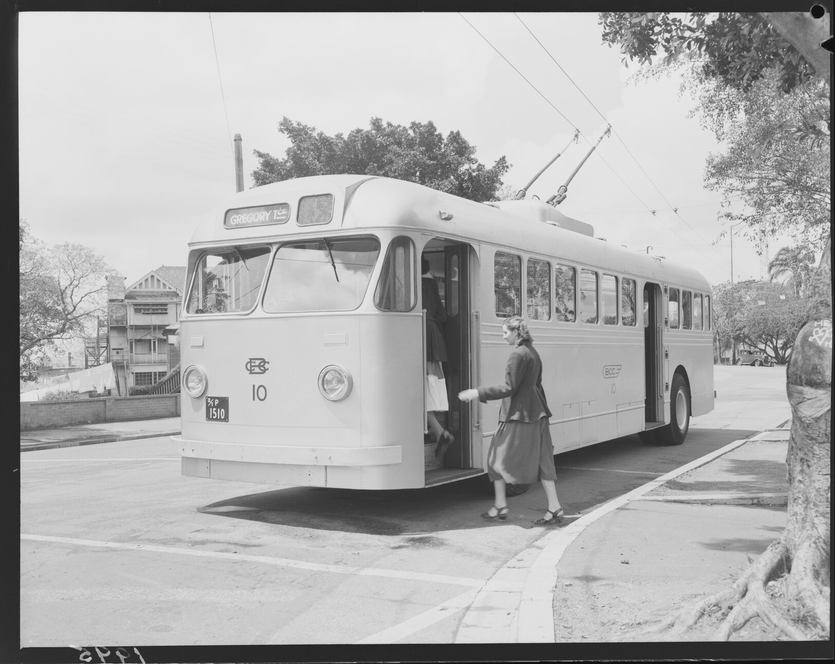 No. 10 Trolley bus in Gregory Terrace with woman boarding, Fortitude Valley, 1951