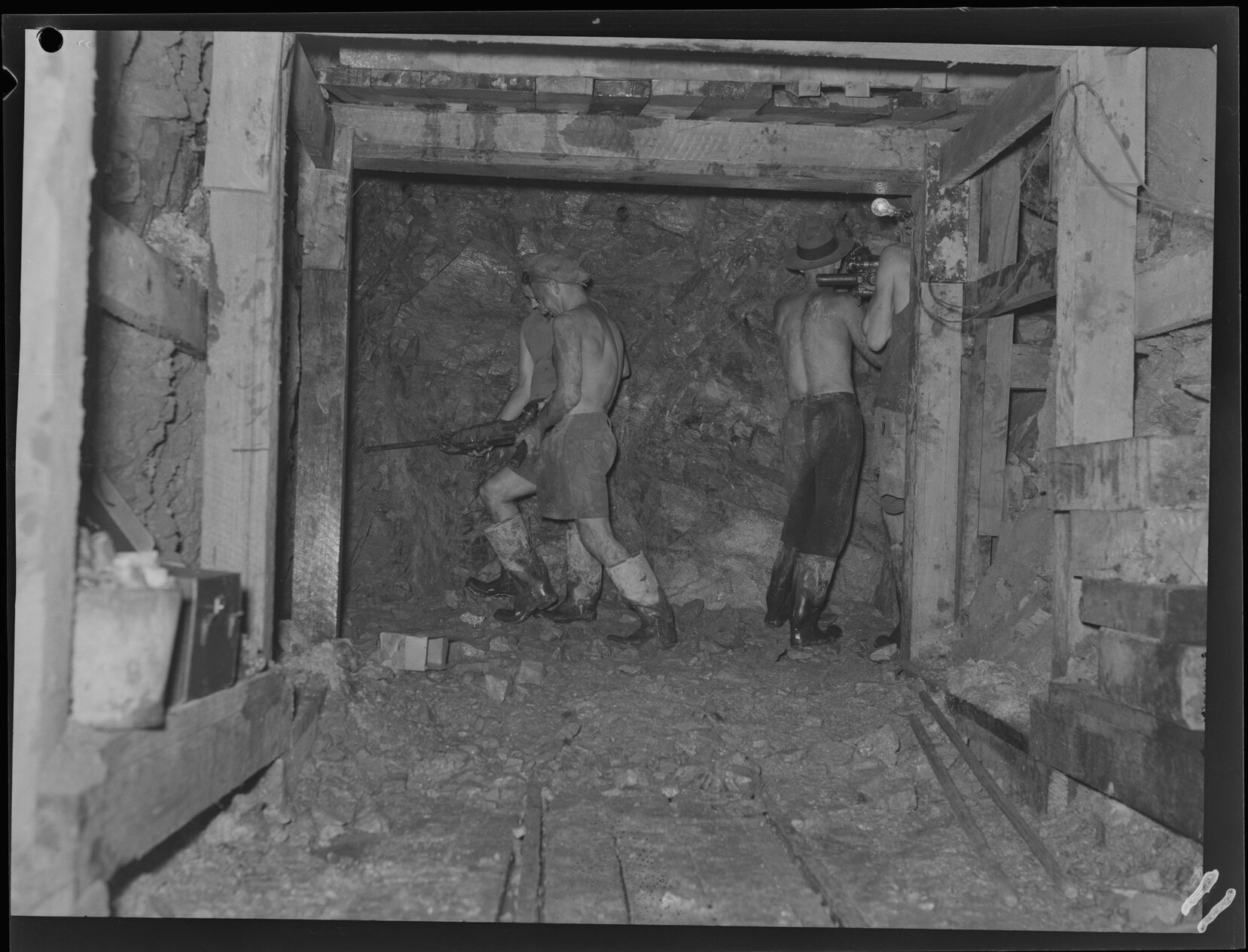 Workers tunneling under Riding Road Balmoral for sewerage line construction - 1949