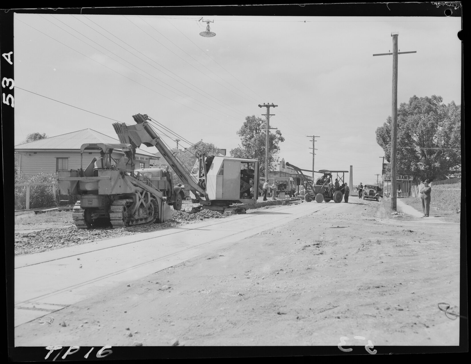 Tram line construction on Samford Road, looking from Lorne Street towards Newmarket brickyard, Alderley