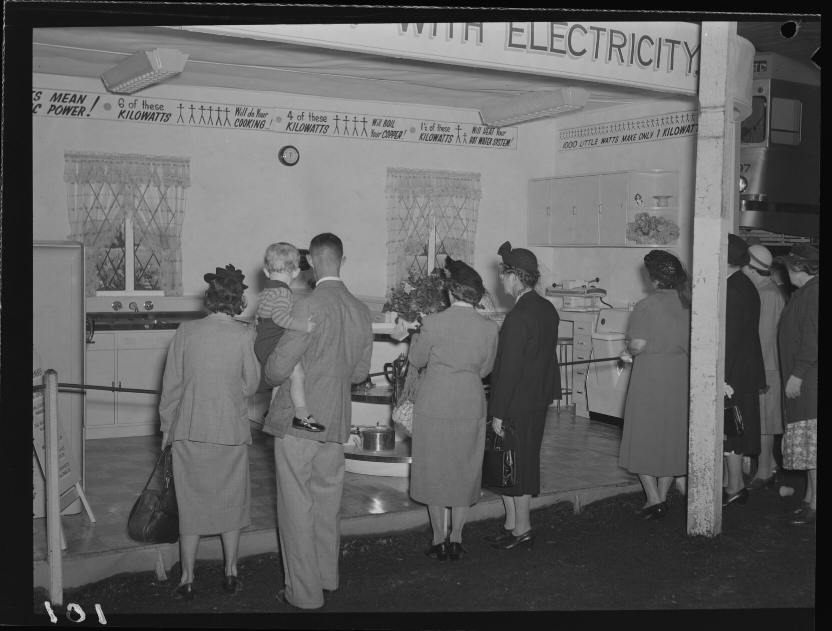 Crowd gathered looking at Department of Electricity Display - Queensland Industries Fair RNA Showgrounds, Bowen Hills - 1949