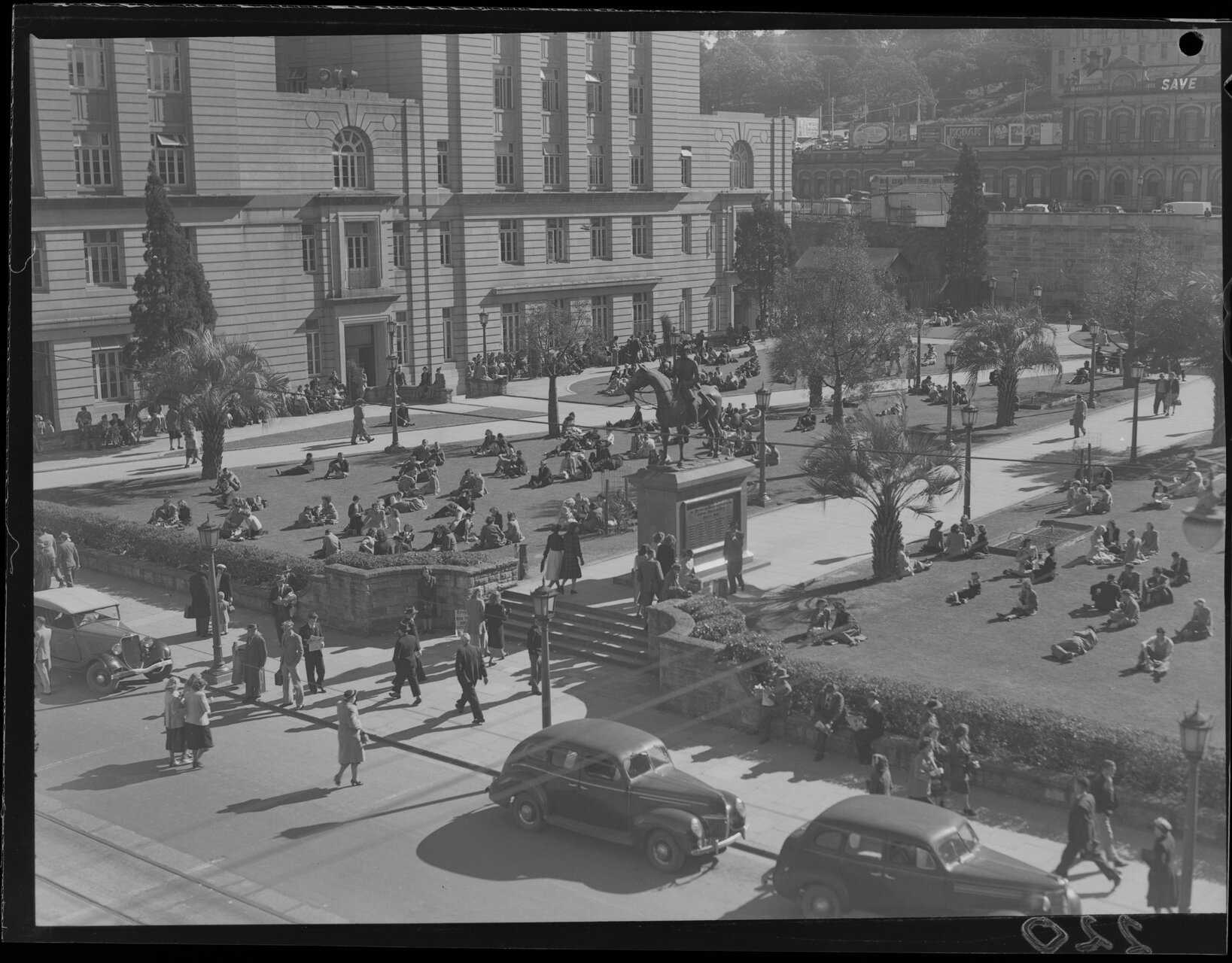 Crowds enjoying the sun in Anzac Square, Brisbane City - 1949