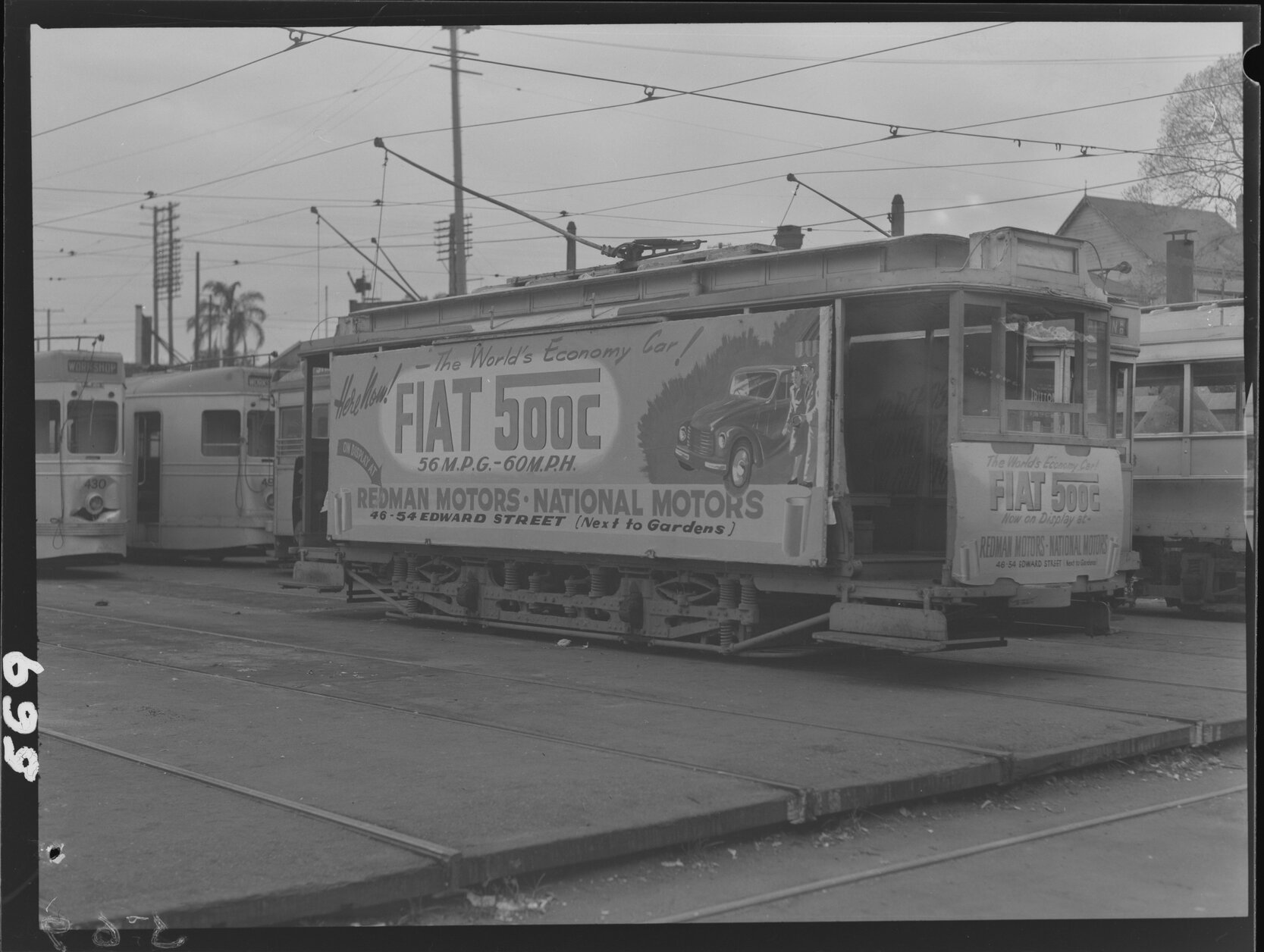 Transport side of tramcar with Fiat 500c advertisement, with damage to tram No. 430 - 1949
