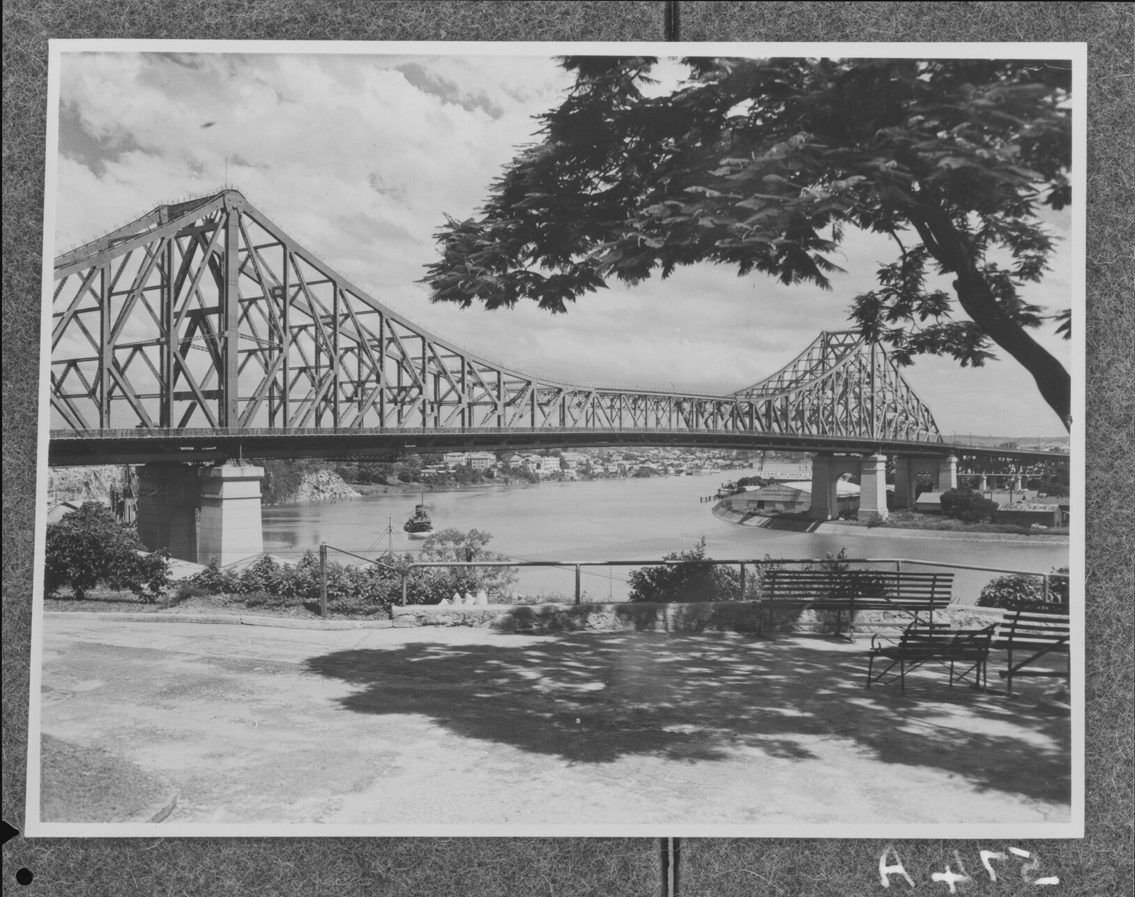 Man admiring Story Bridge from Ivory Street, Brisbane City - 1949
