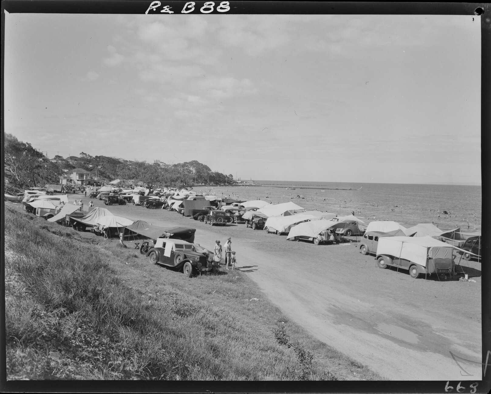 Overlooking Sutton's Beach, Redcliffe, with campers - 1948