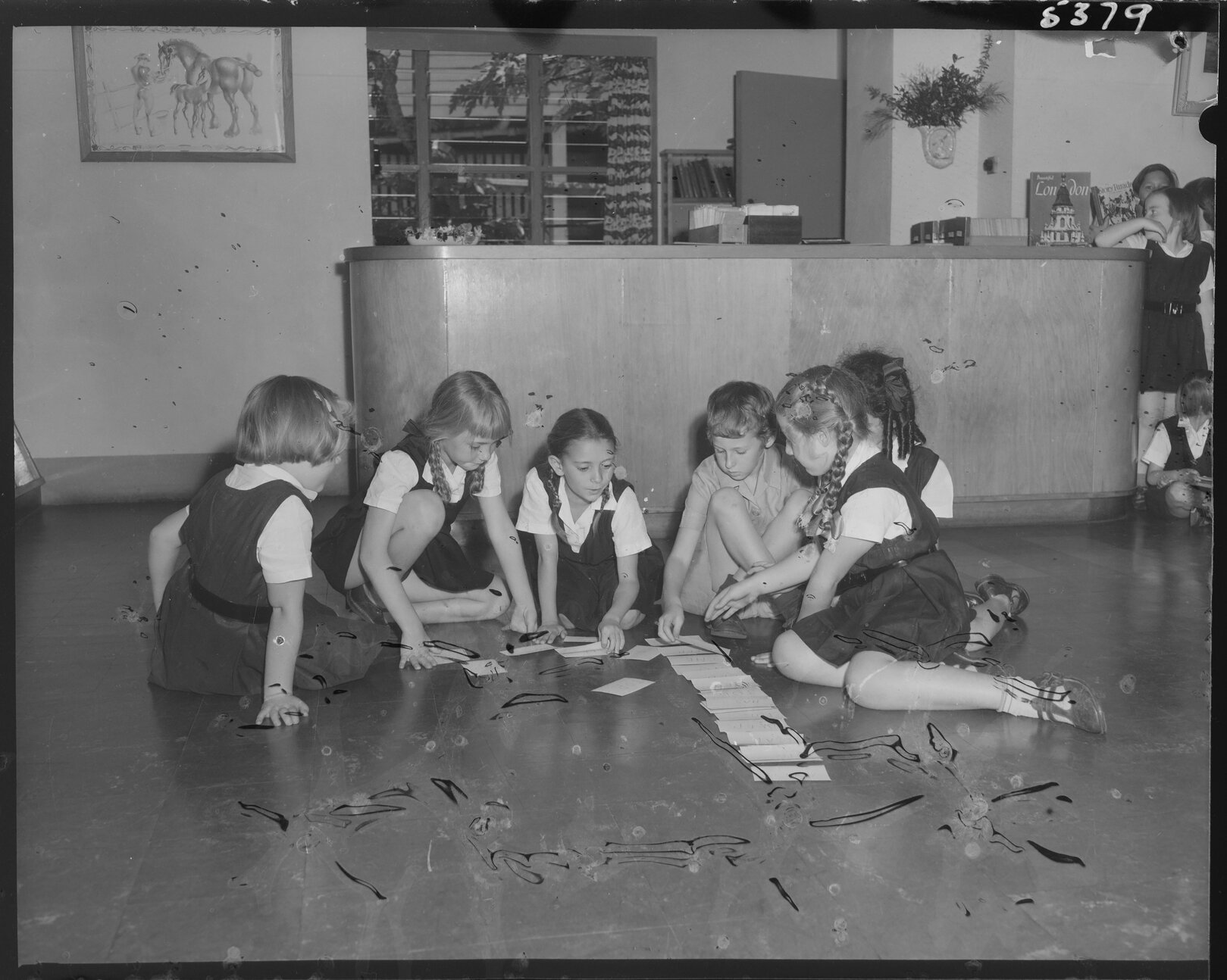 Group of shoolchildren playing, South Brisbane Children's Library - 1954