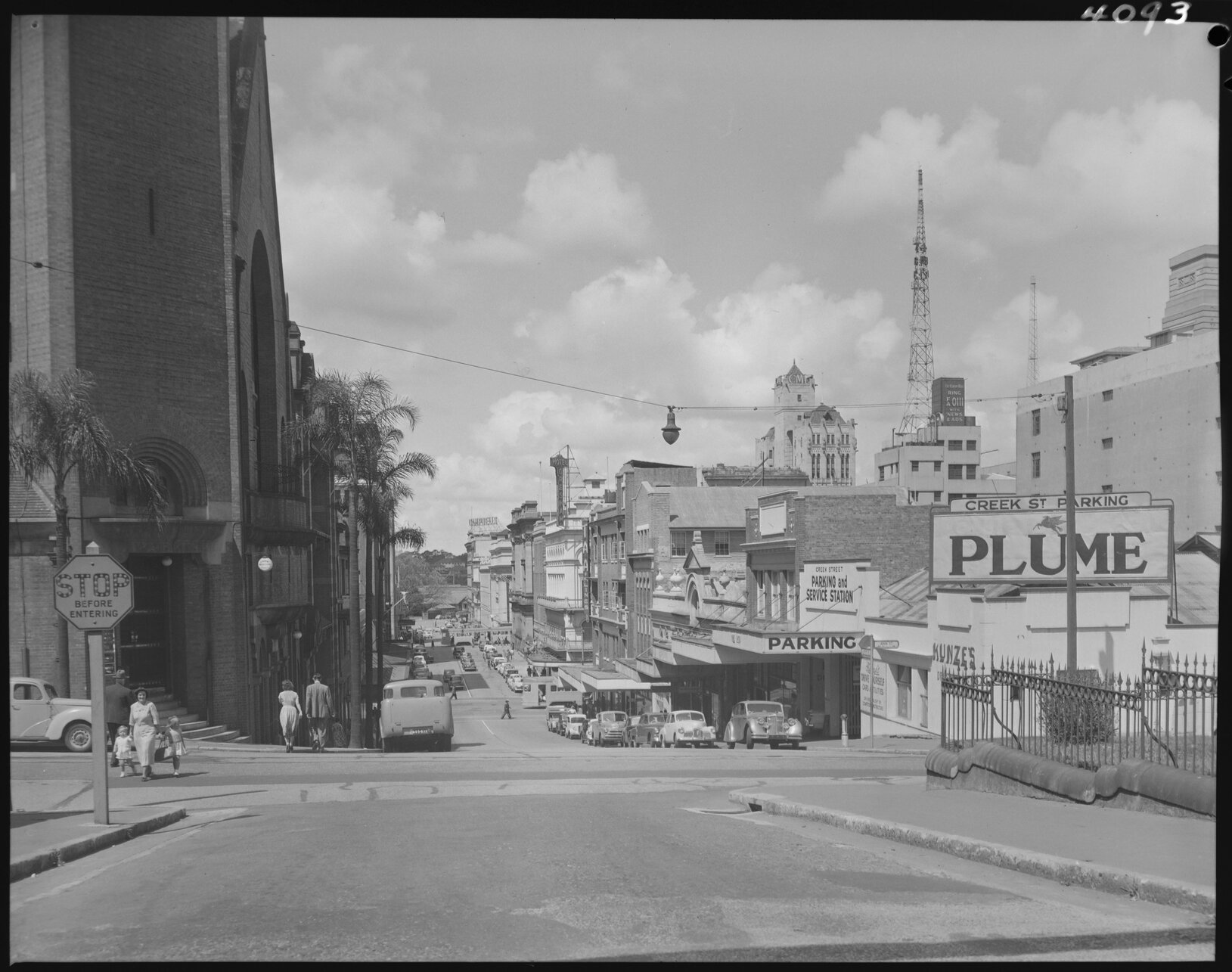 Creek Street from Ann Street corner with shops and St Andrews Uniting Church - 1953