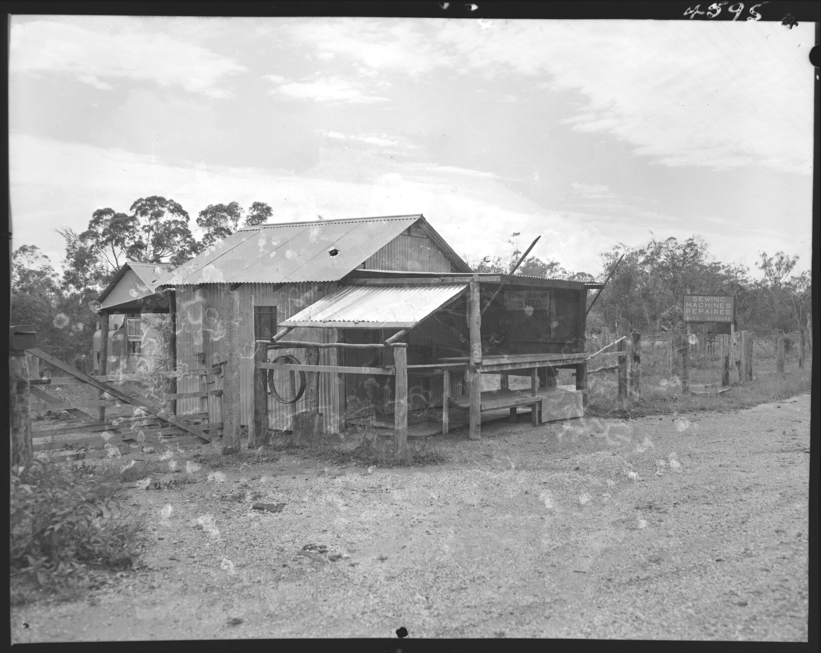 Roadside house offering sewing machine repairs, Wynnum and Cleveland Roads - 1954