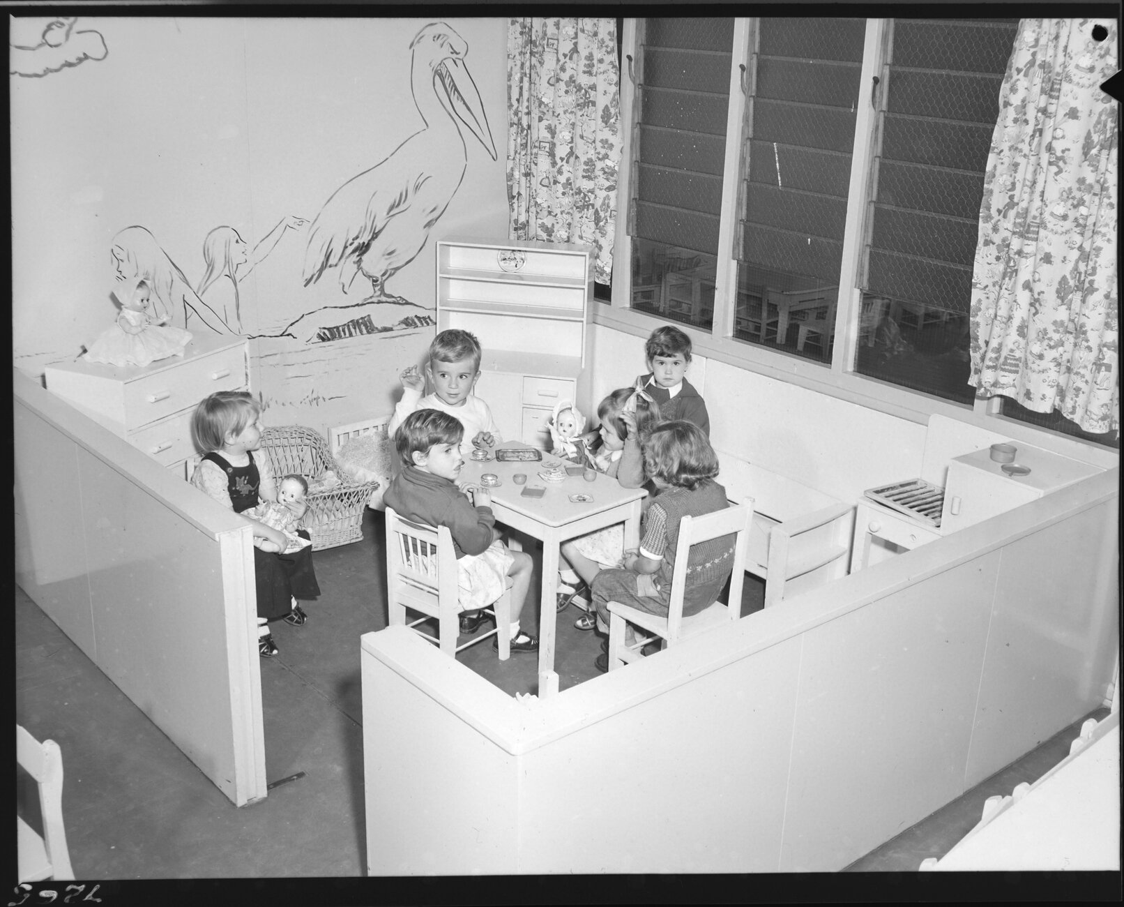 Children playing with dolls at Kindercraft Civic Day Nursery at City Hall - 1956