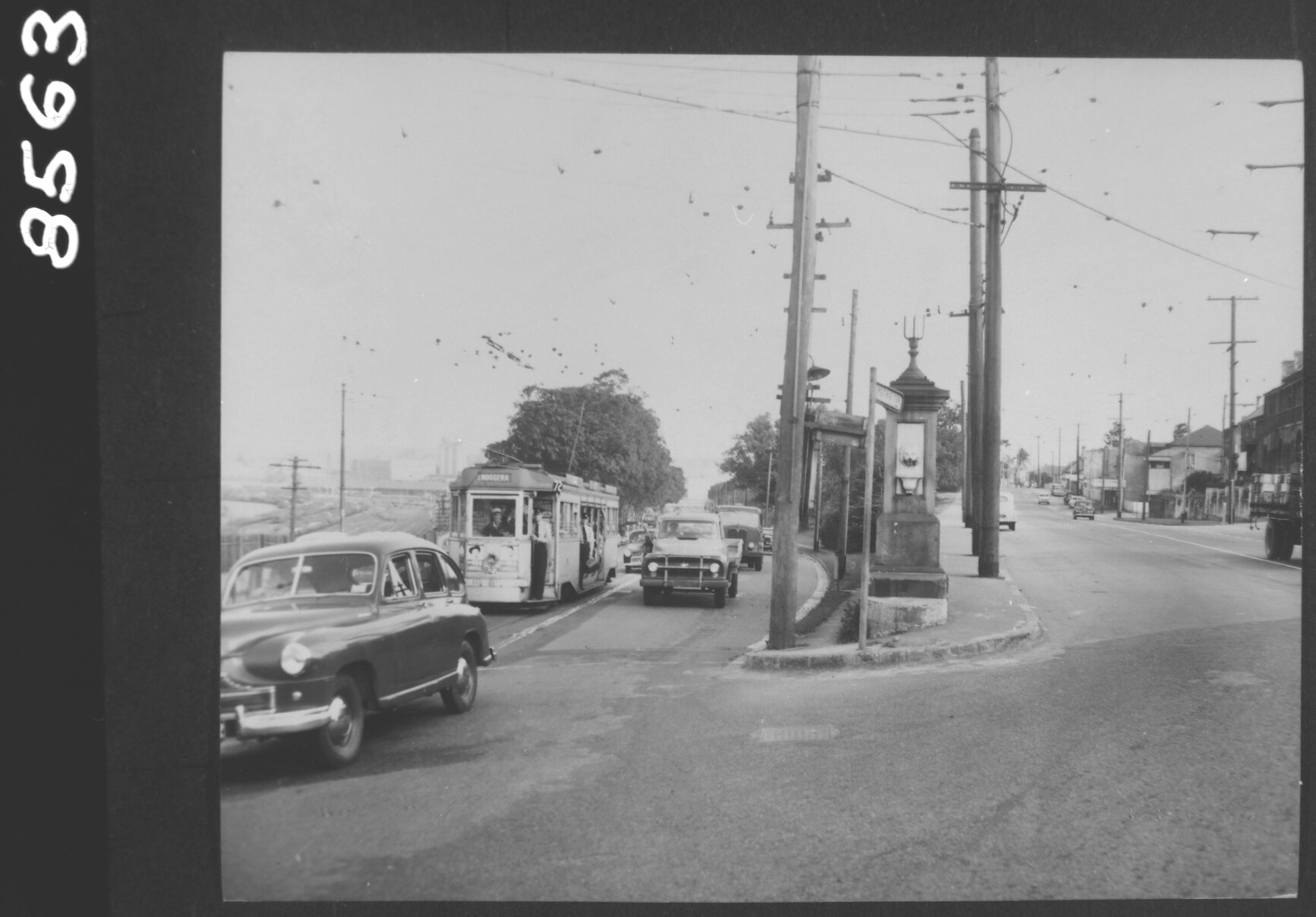 Traffic on Countess Street and Petrie Terrace including Tram No. 827 bound for Enoggera, Brisbane City and Petrie Terrace -1957