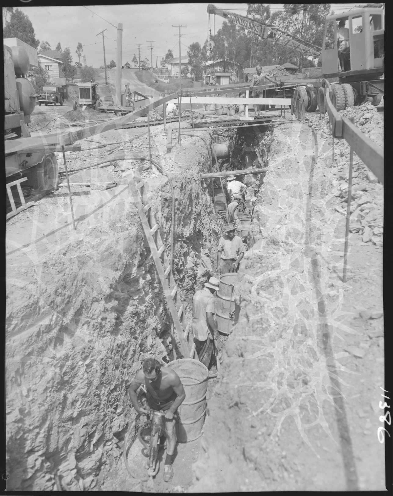 Council workers digging trench for Wynnum to Tarragindi sewer mains, possibly in Cannon Hill - 1958