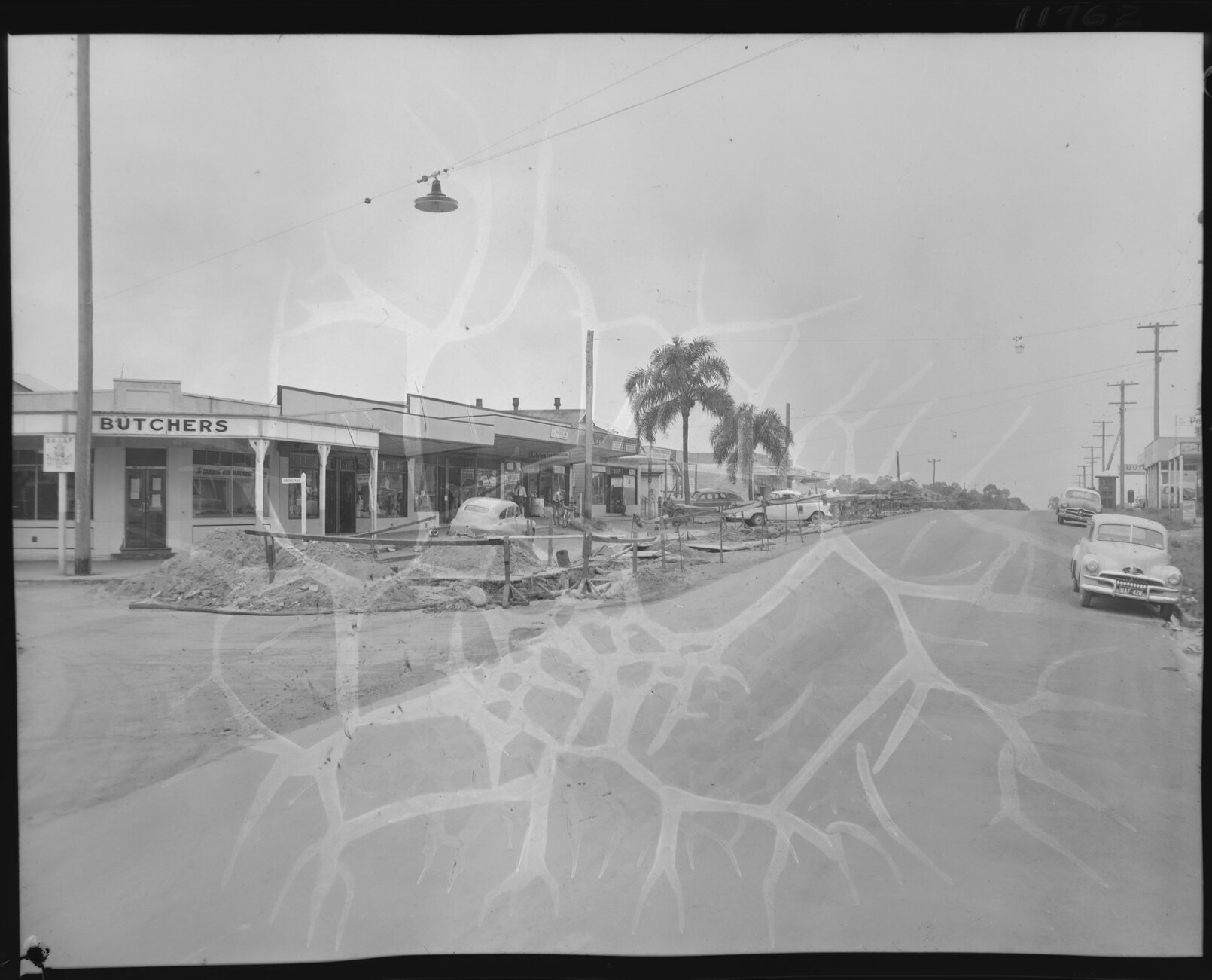 Corner of Barrack and Wynnum Road showing shops, Cannon Hill - 1959