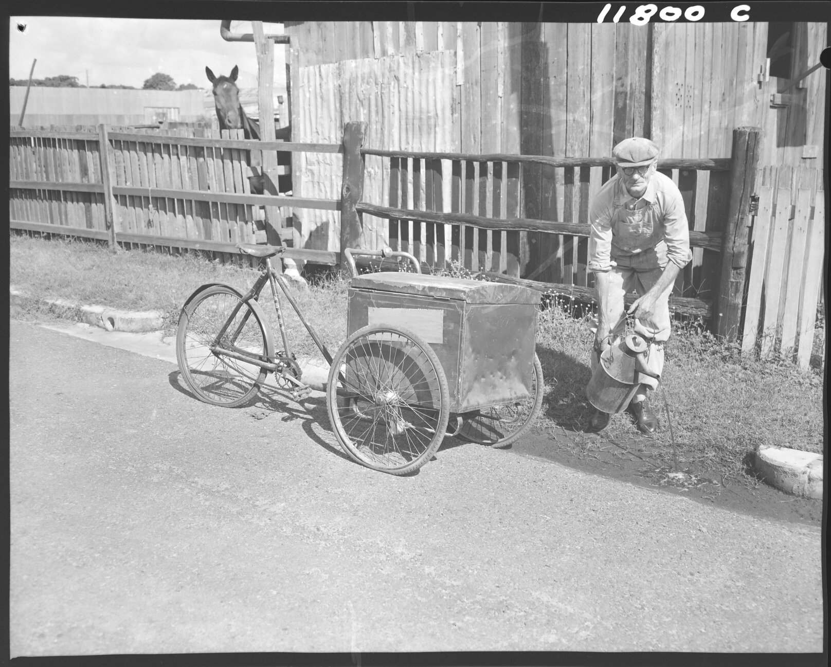 Council worker pouring oil in gutters to stop mosquito larvae breeding - 1959 
