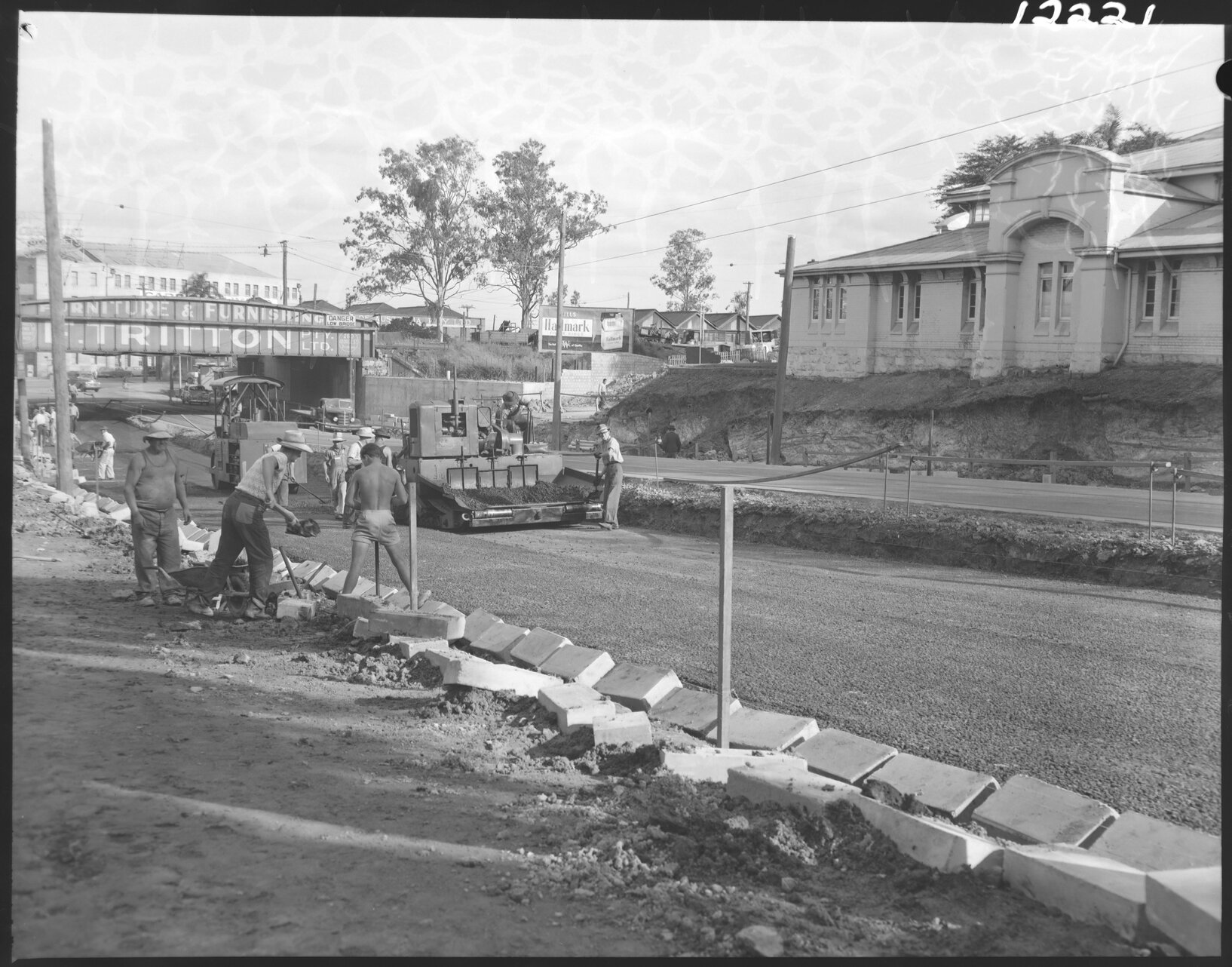 Lowering roadworks for the Countess Street rail bridge with Victoria Barracks building, Petrie Terrace and Brisbane City - 1959