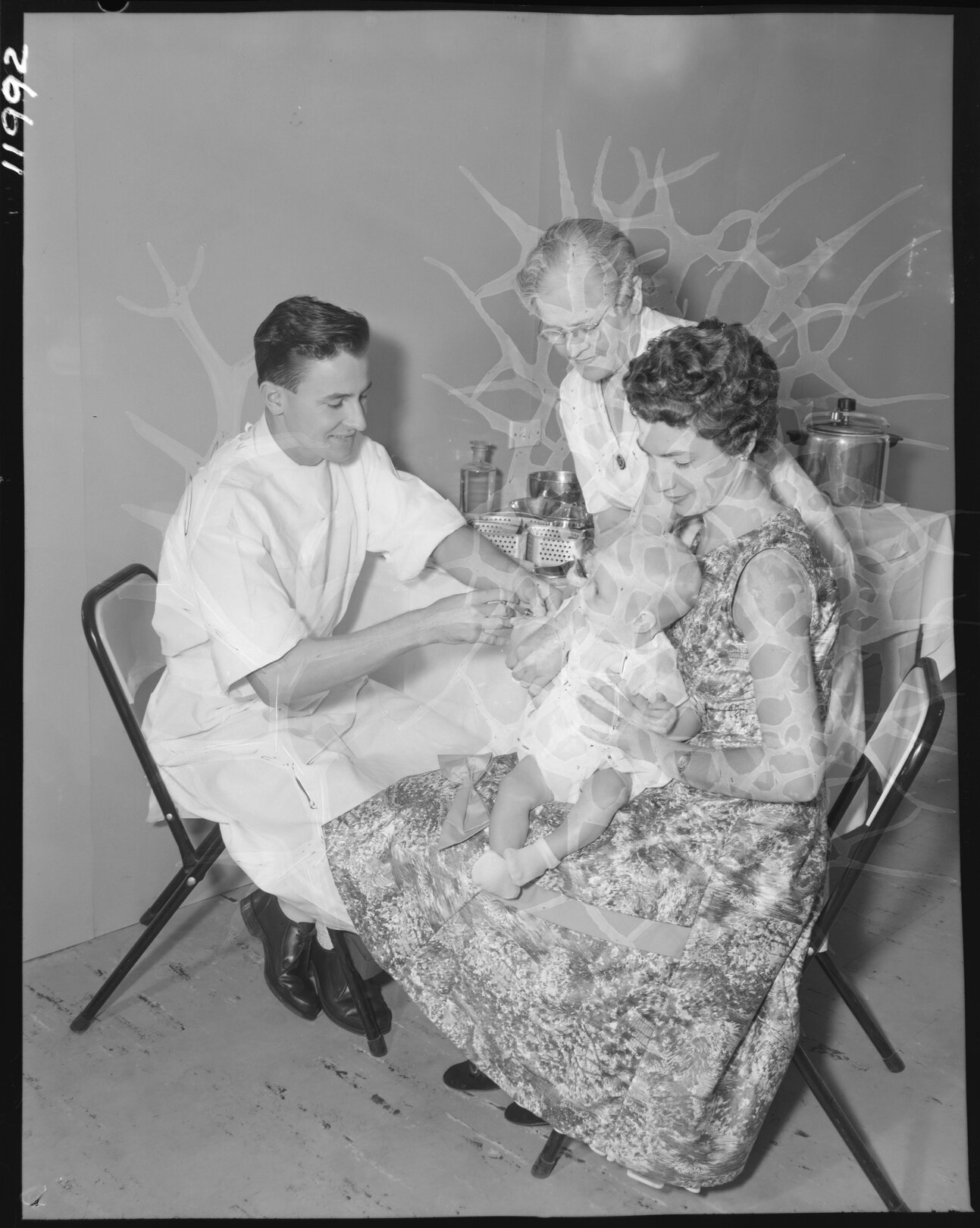 Baby being vaccinated at City Hall immunisation centre, Brisbane City - 1959