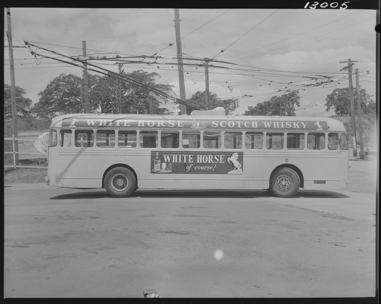 Trolley bus No. 8 advertising White Horse Whiskey - 1959