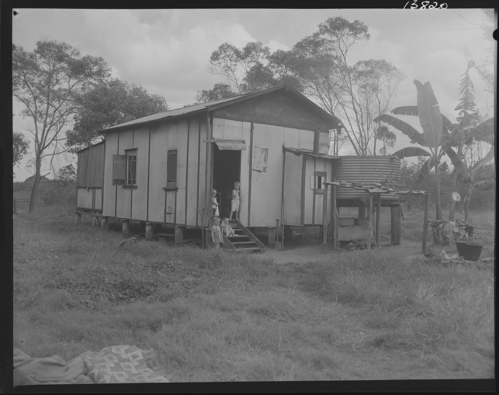 Temporary housing with three children and dog, Inala - 1960