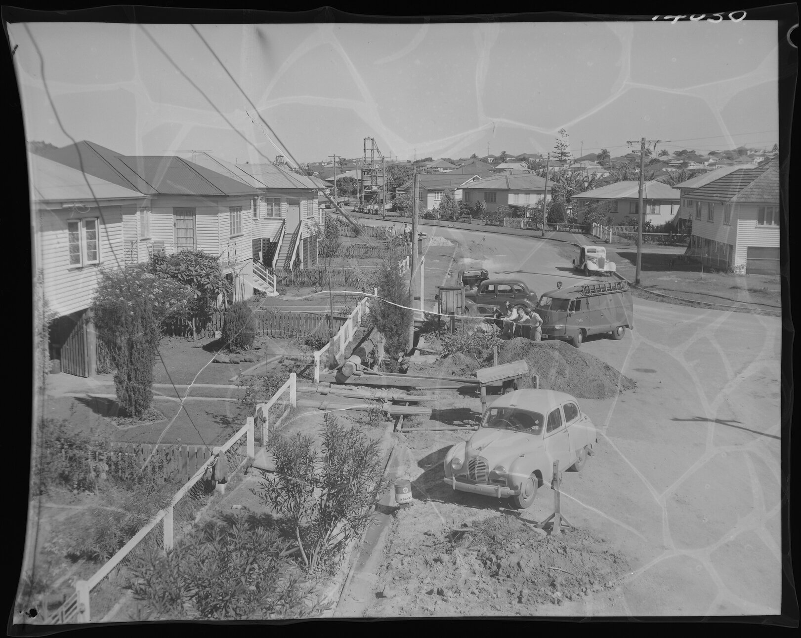 Inspecting collapsed footpath over sewer pipe for North Kedron Brook sewer line - 1960