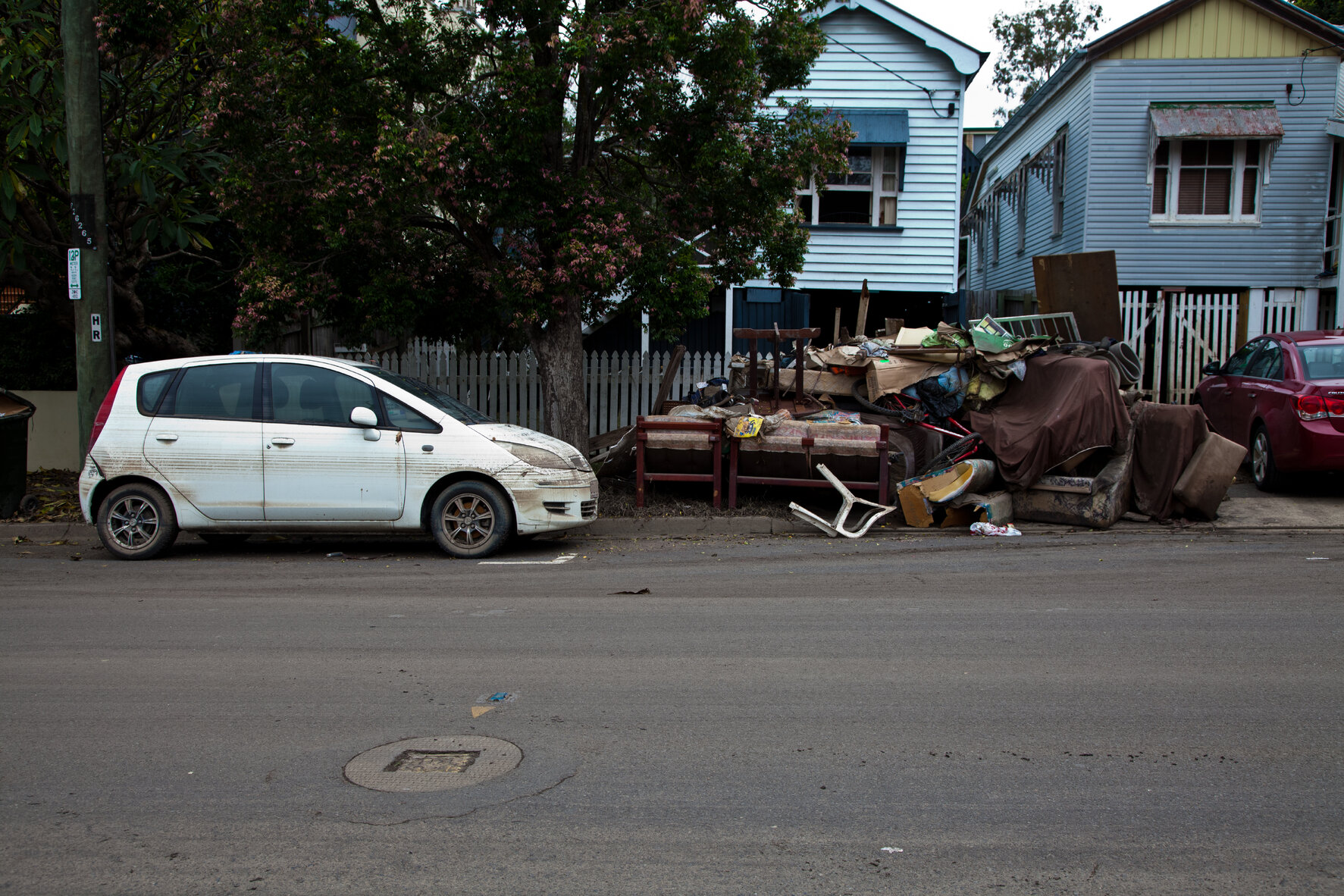 High water marks left on car with destroyed furniture on kerb after flooding, Rosalie, Paddington - 2011