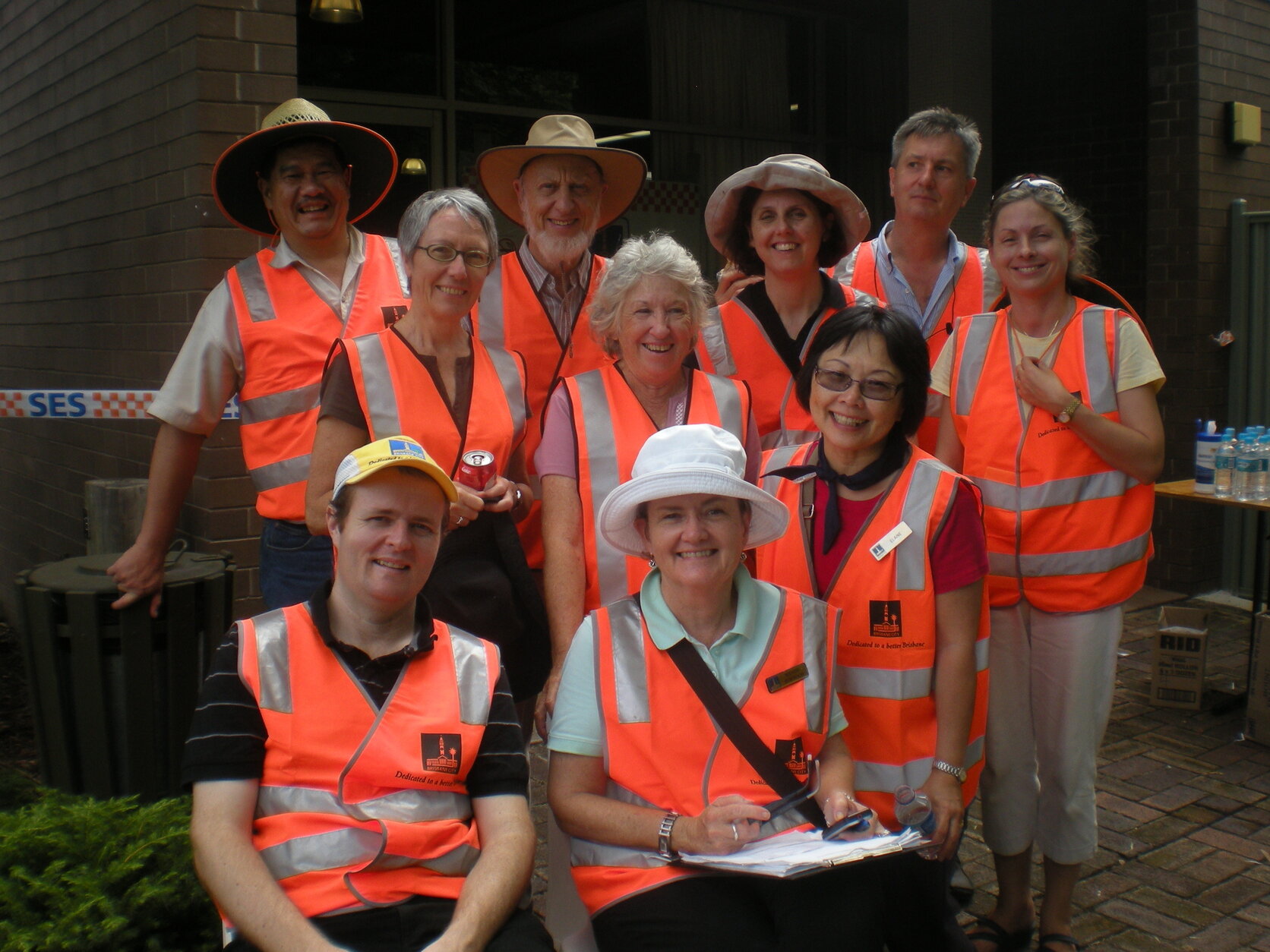 Group photo of council workers administering Mud Army signups, Mt Coot-Tha - 2011