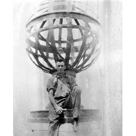 Workman Sitting on Top of City Hall Clock Tower 1929